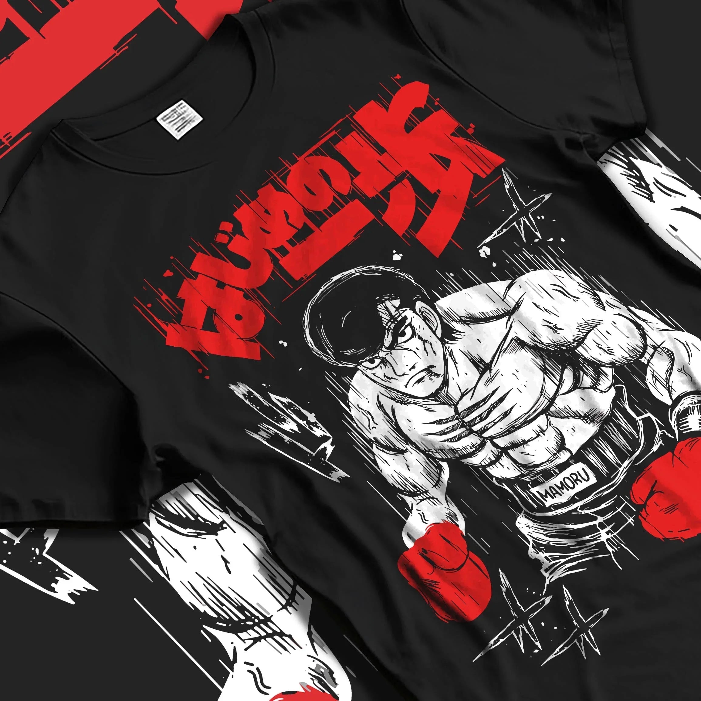 Black T-shirt laid flat featuring Hajime no Ippo anime graphic of Ippo Makunouchi in boxing stance with bold red Japanese text.