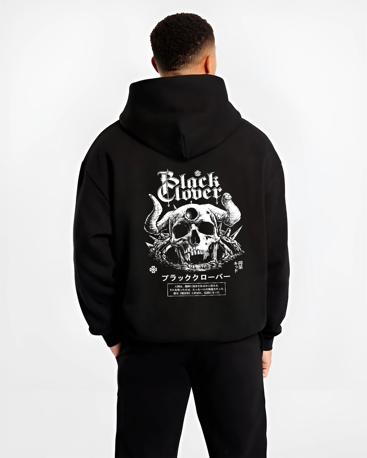 Black hoodie worn by a male model, back view, featuring Black Clover anime poster inspired skull and horns design with bold Japanese manga graphic.