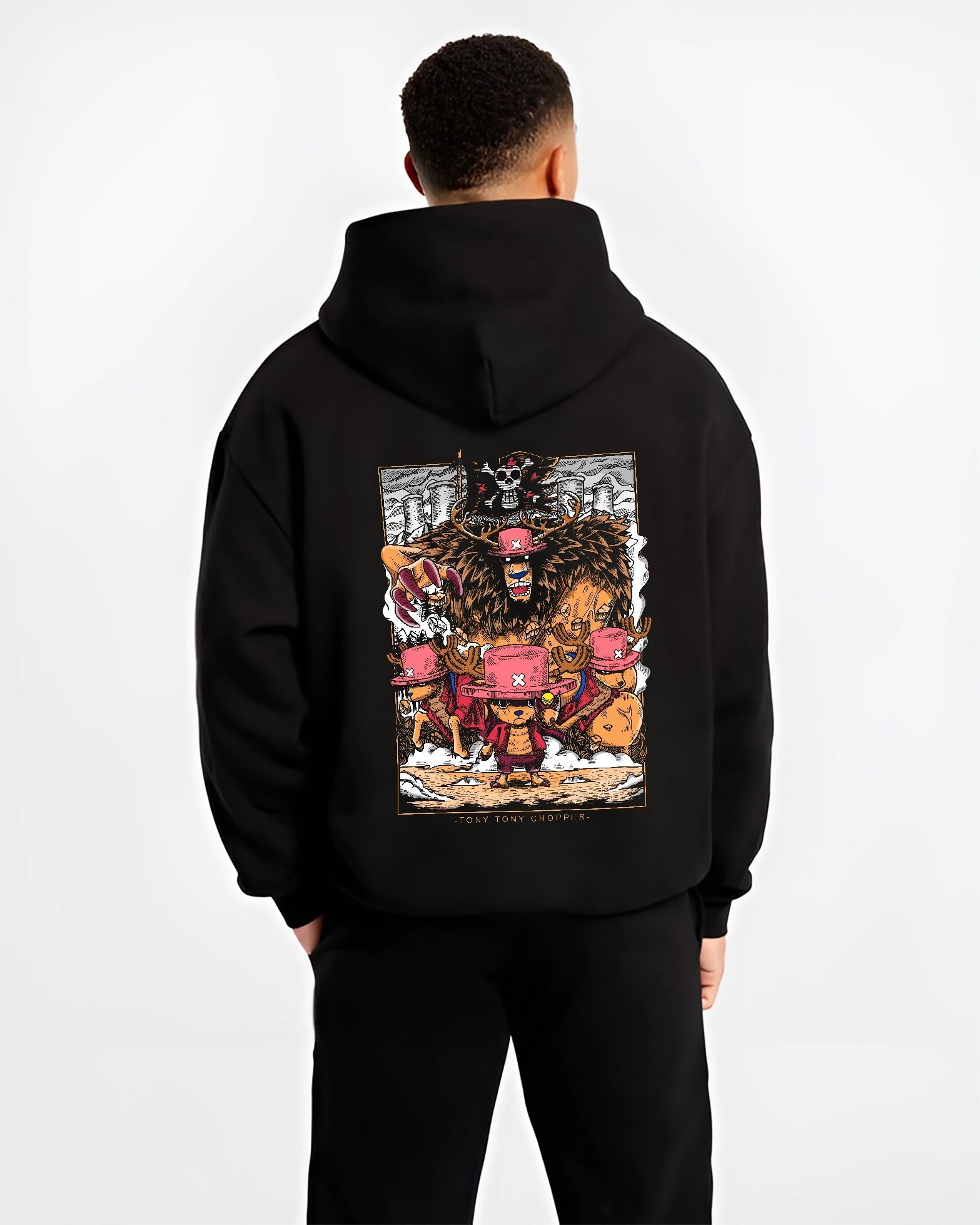 Black hoodie worn by a male model, back view, featuring One Piece Chopper anime poster inspired artwork with monster transformation in bold retro manga battle style.