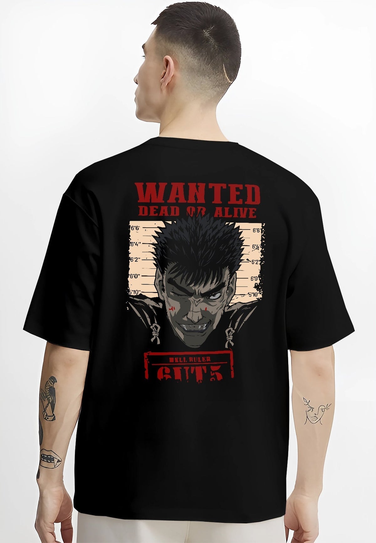 Black T-shirt worn by a male model, back view, featuring Berserk retro manga wanted poster of Guts with dark anime streetwear style and bold red text.