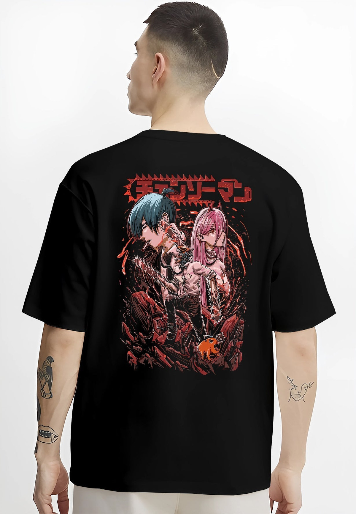 Black T-shirt worn by a male model, back view, featuring Chainsaw Man characters Power and Aki in anime poster inspired artwork with dark shonen battle vibe.