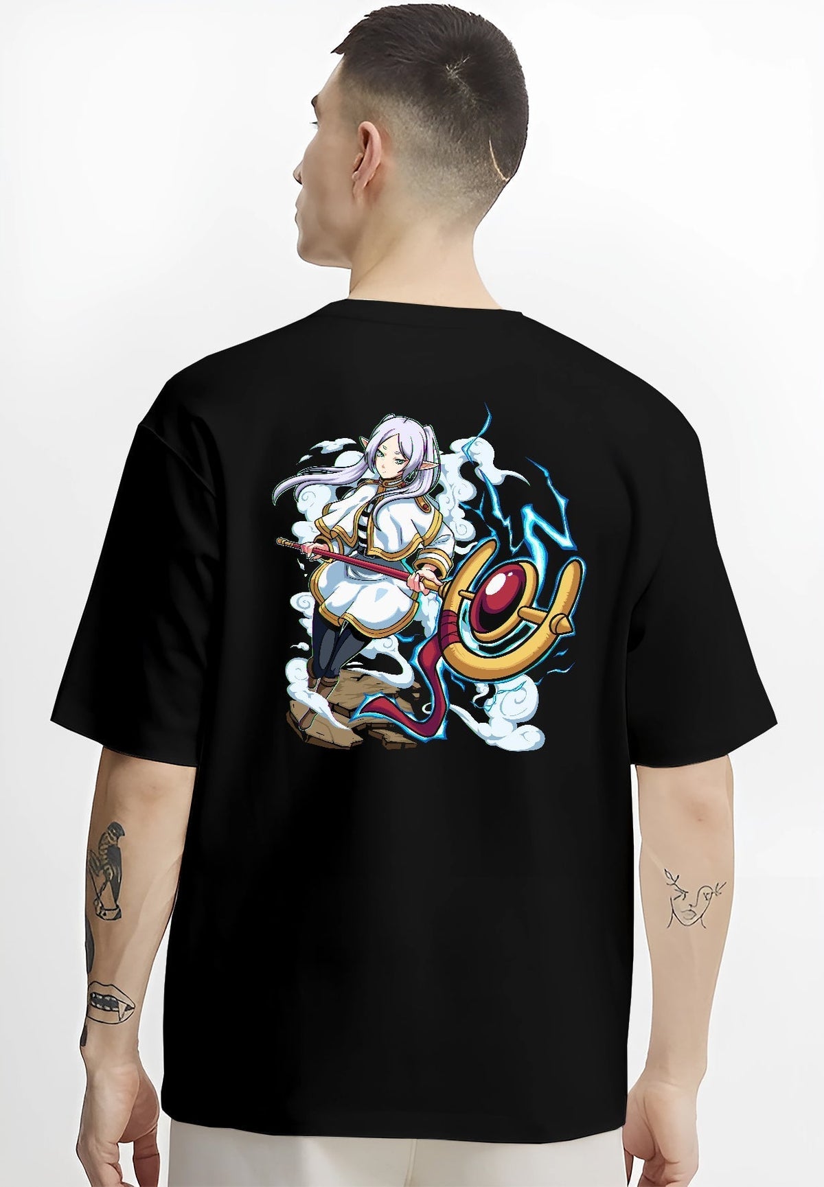Black T-shirt worn by a male model, back view, featuring Black Clover Mereoleona retro manga graphic design with sword, lightning, and Japanese streetwear vibes.