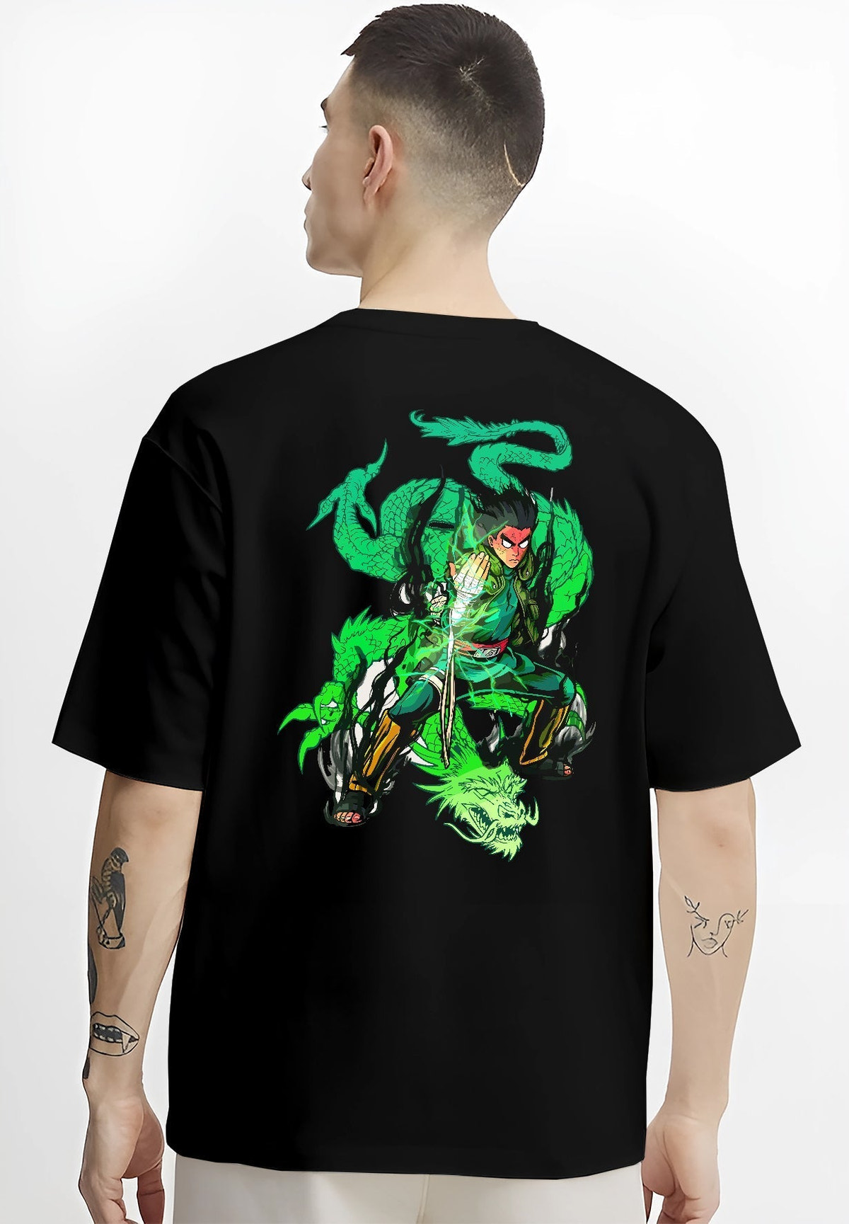 Black T-shirt worn by a male model, back view, featuring Dragon Ball Gohan anime poster inspired design with shonen battle stance and green Shenron dragon aura effect.