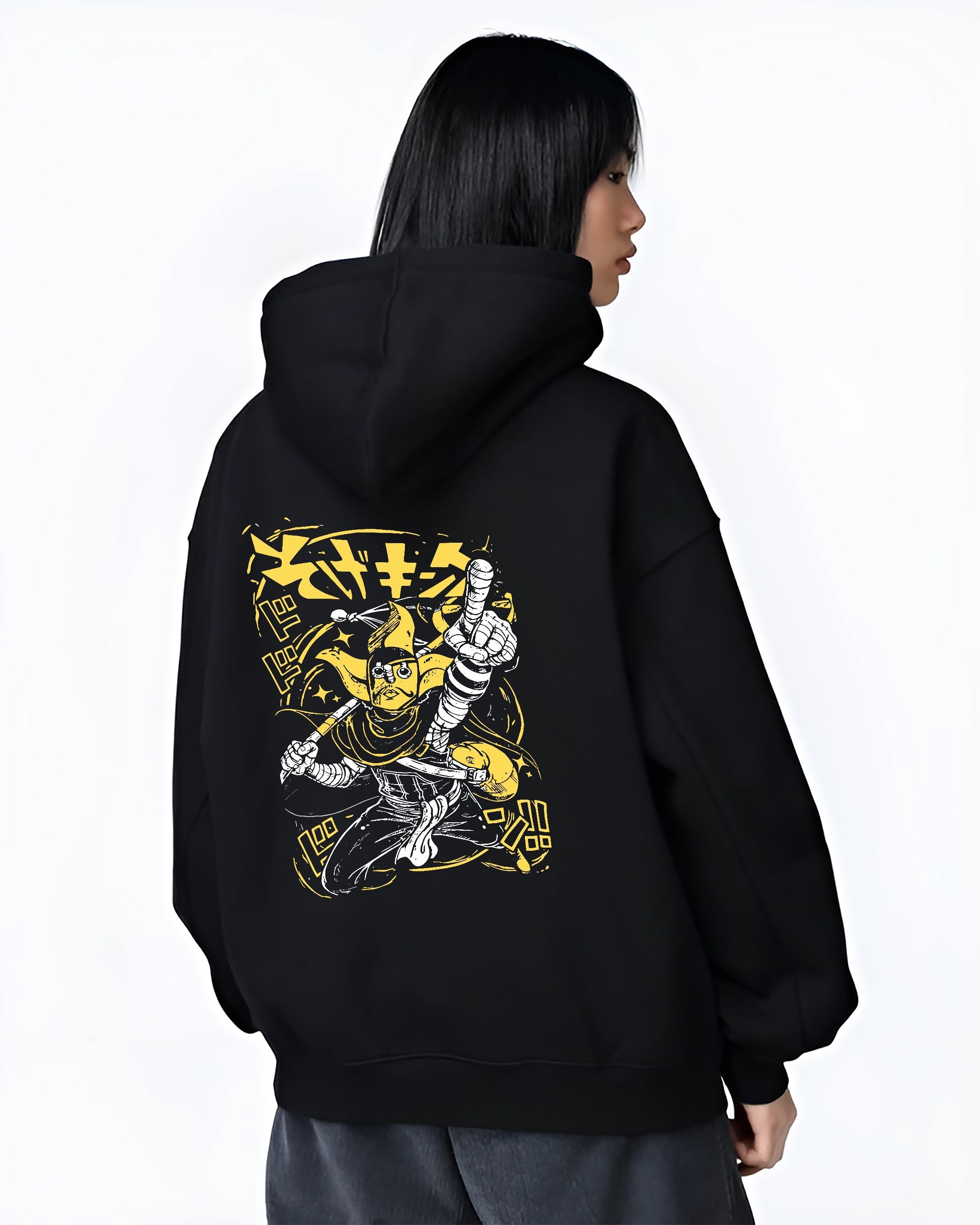 Black hoodie worn by a female model, back view, featuring JoJo’s Bizarre Adventure The World Stand retro manga artwork in bold yellow tones with comic streetwear aesthetic.