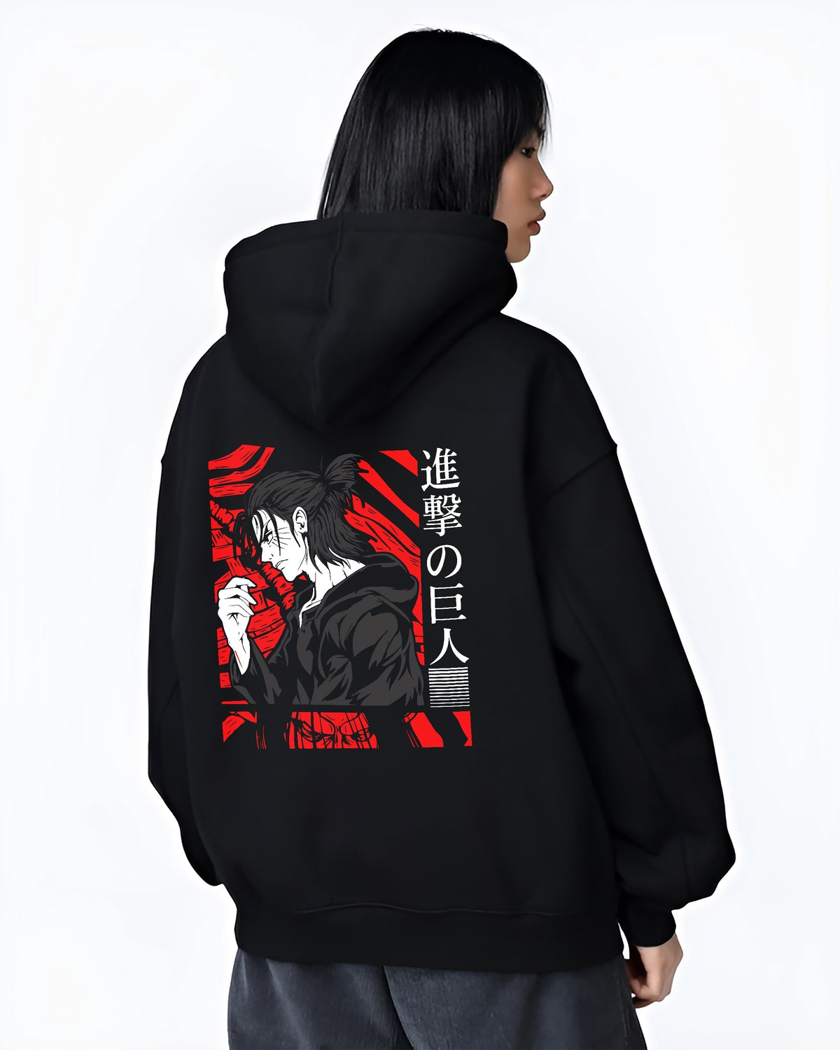 Black hoodie worn by a female model, back view, featuring Attack on Titan Eren Yeager retro manga graphic portrait design in anime poster inspired artwork with bold red style.