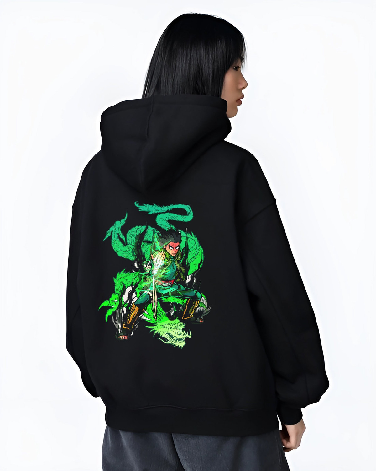 Black hoodie worn by a female model, back view, featuring Dragon Ball Gohan anime poster inspired artwork with glowing green Shenron dragon aura in retro manga graphic style.