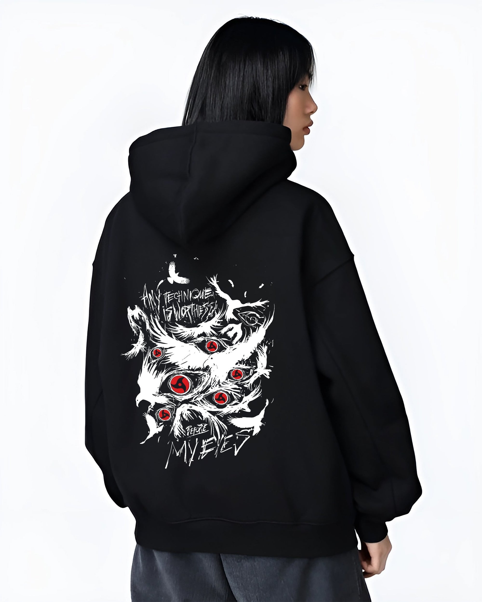 Black T-shirt worn by a male model, back view, featuring Naruto Sharingan retro manga graphic with bold red eyes and abstract white sketch style.