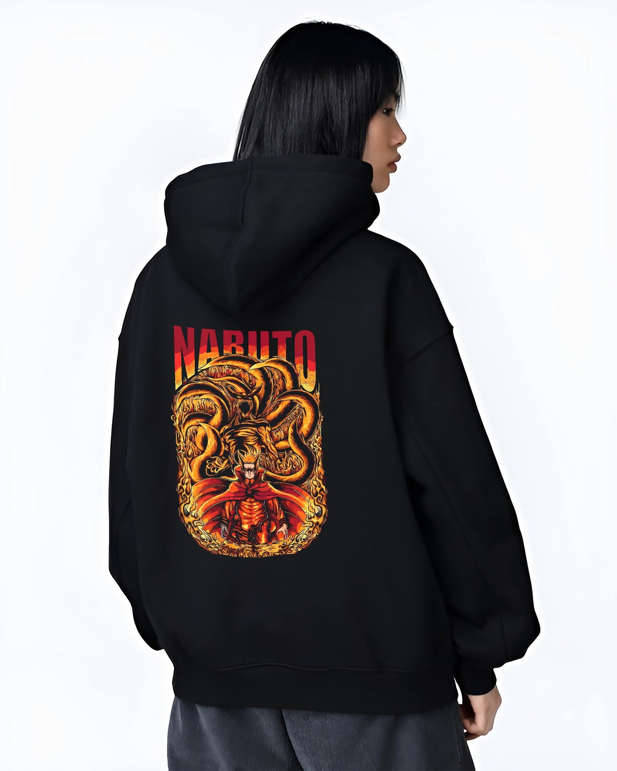 Black hoodie worn by a female model, back view, featuring Naruto and Kurama fiery anime streetwear graphic with retro manga aesthetic.