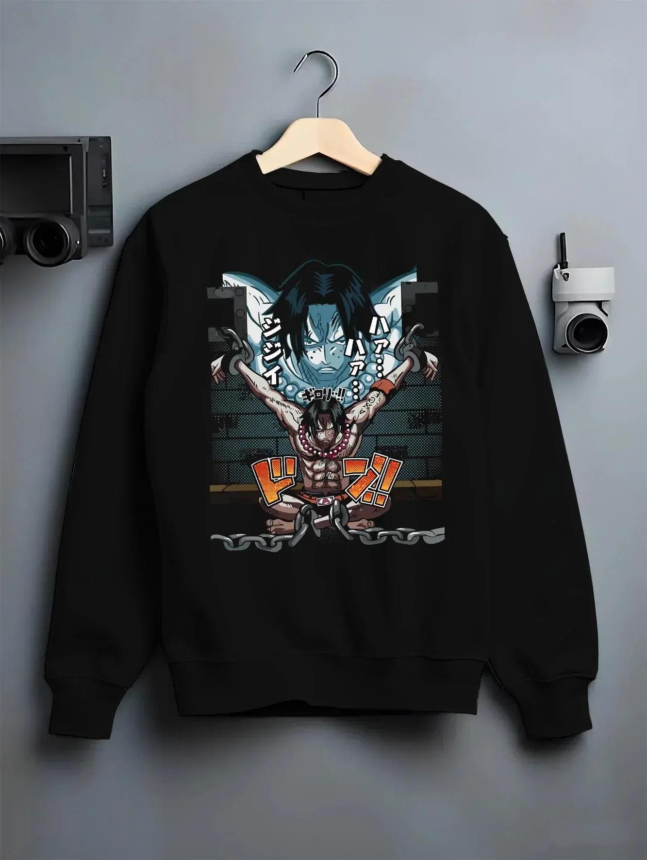 Black crewneck sweatshirt on hanger with Portgas Ace Chains Hoodie One Piece Prison Cell Flames graphic streetwear graphic.