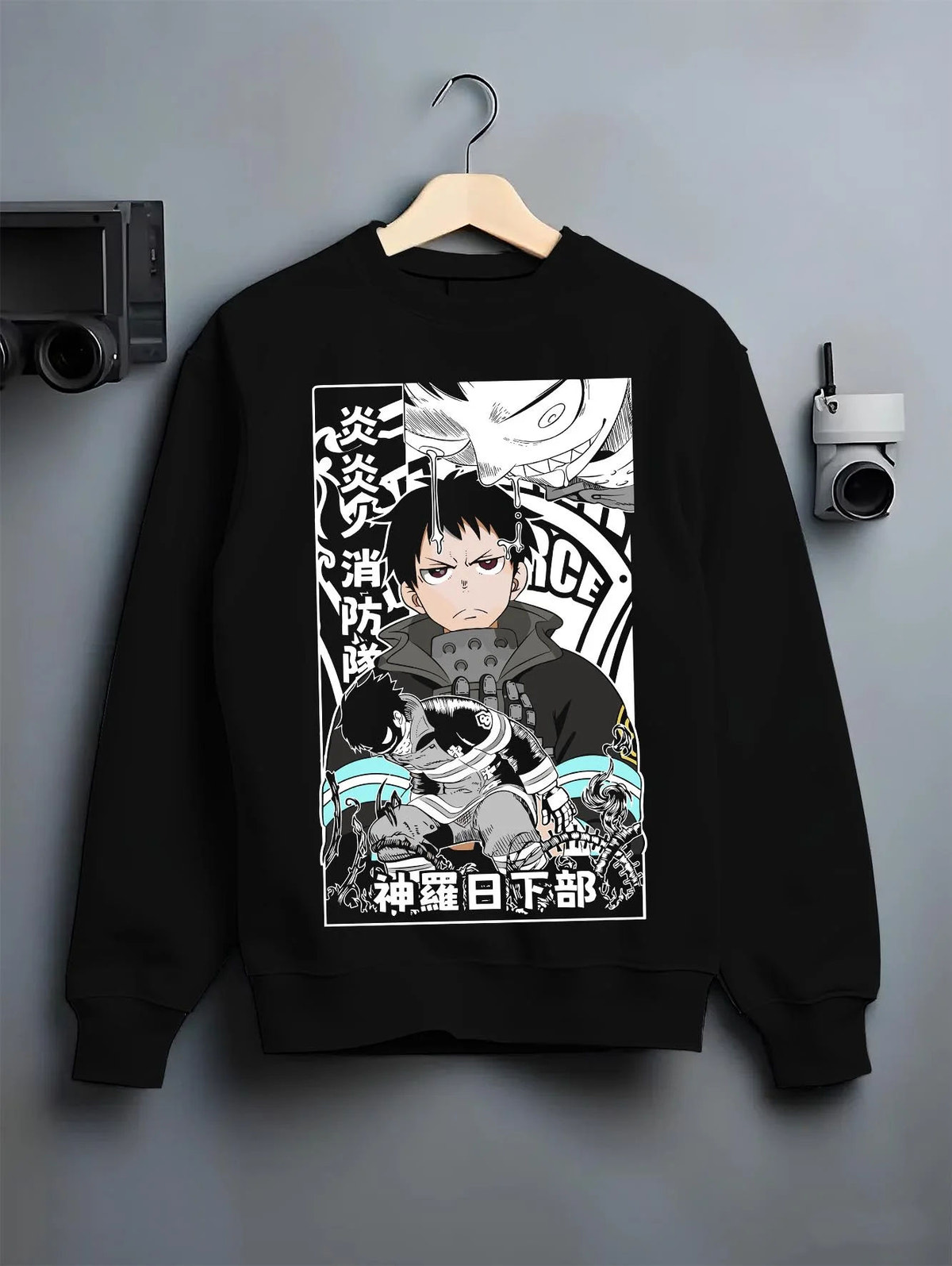 Black crewneck sweatshirt on hanger featuring Adolla Burst Shinra Fire Force monochrome artwork.