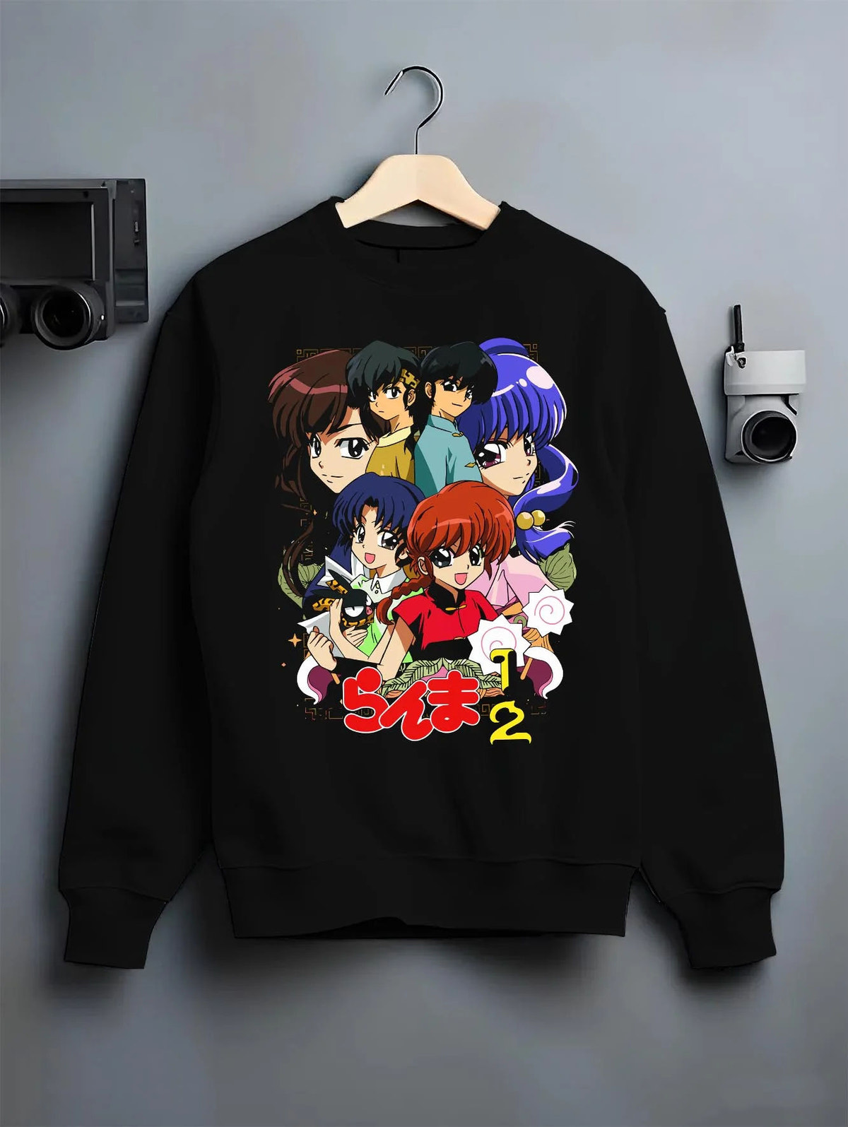 Black crewneck sweatshirt on hanger featuring Ranma and Akane Ranma 1/2 retro manga duo artwork.