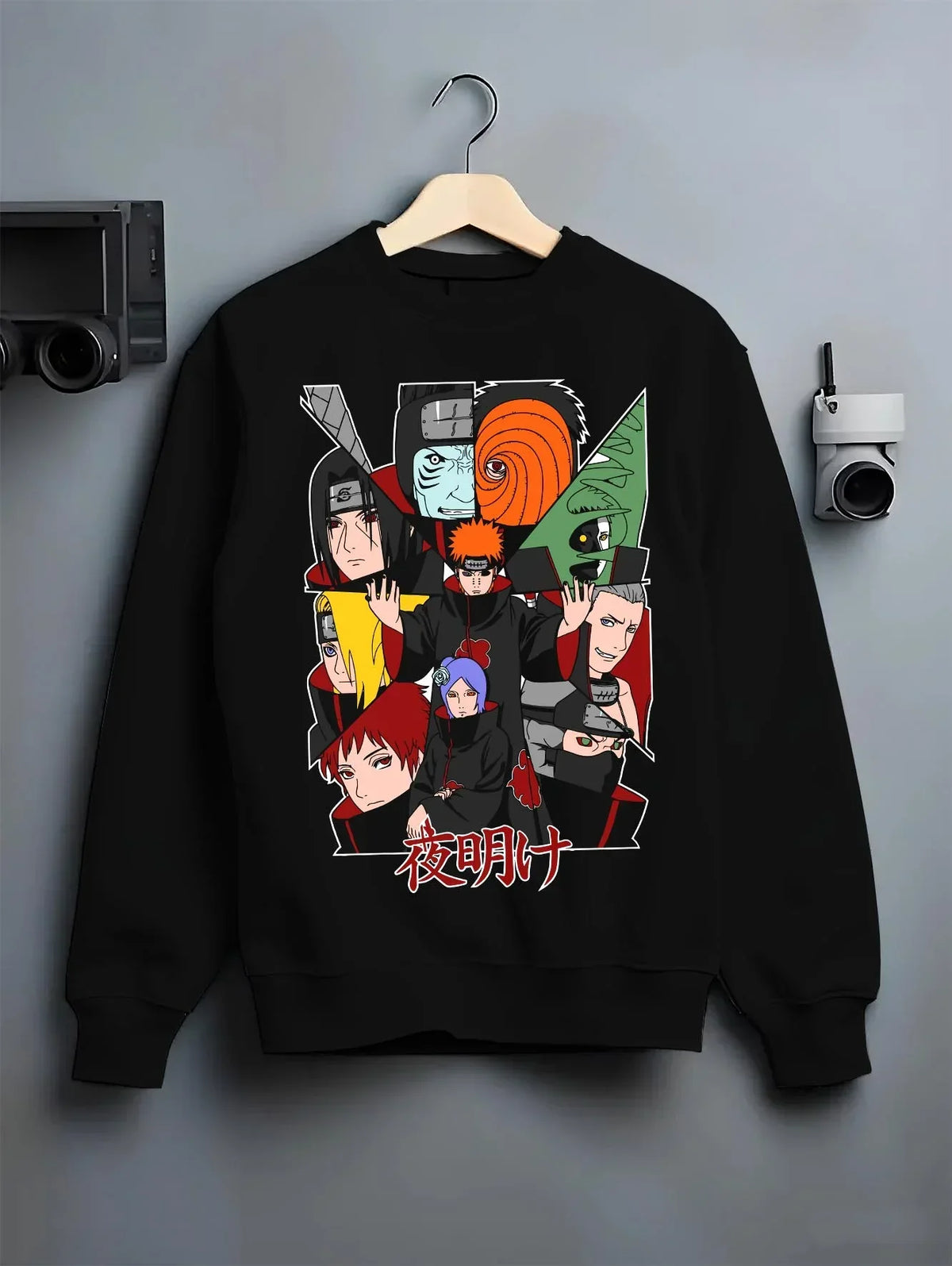 Black crewneck sweatshirt on hanger with Akatsuki Clan Hoodie Naruto Shippuden Red Cloud Team graphic premium wear.