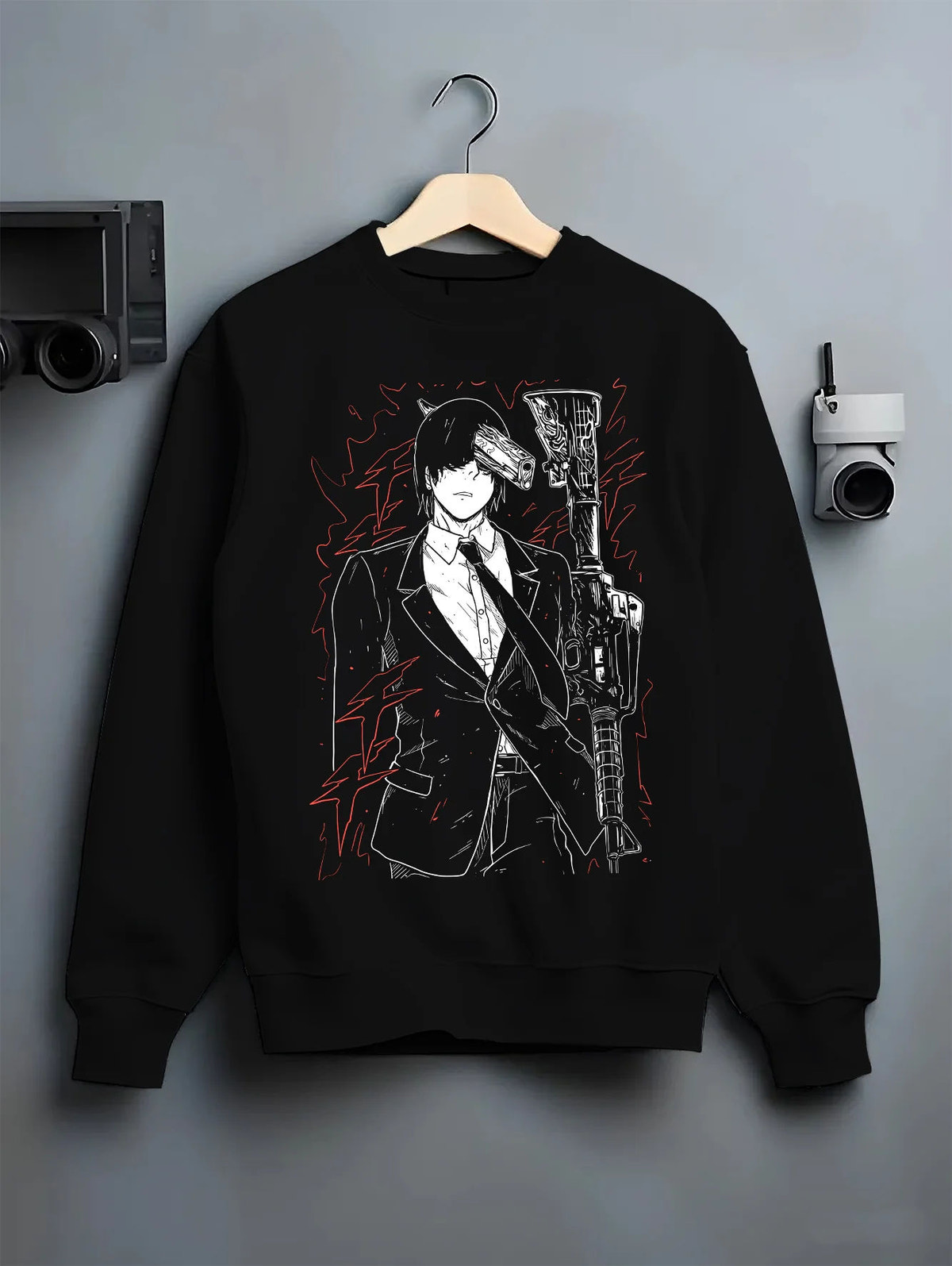 Black crewneck sweatshirt on hanger showing Aki Hayakawa from Chainsaw Man: portrait with weapons