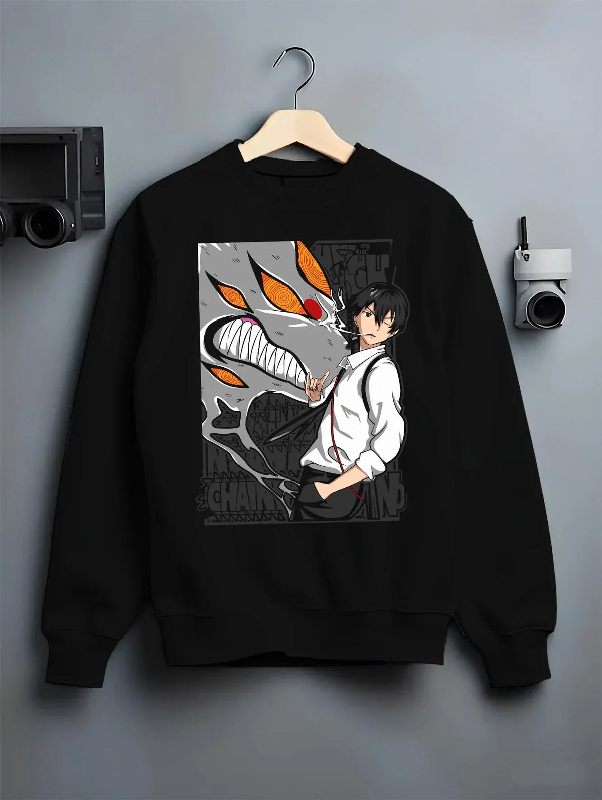 Black crewneck sweatshirt on hanger with Chainsaw Man Hoodie Denji Devil Hunter Chainsaw Blades graphic Denji anime design.