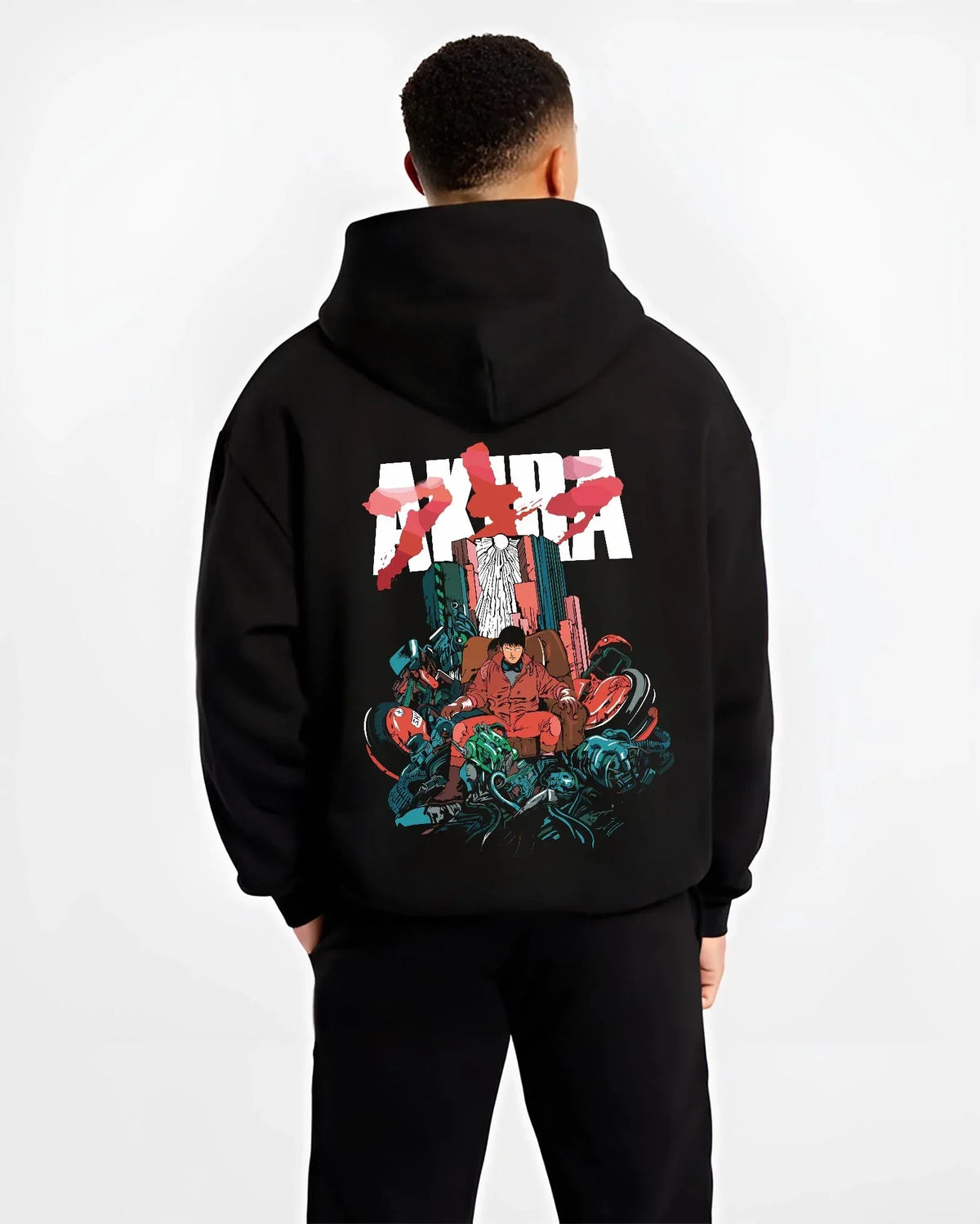 Black hoodie worn by male model, back view with Akira Neo Tokyo Hoodie Capsule Motorcycle Retro Panel graphic premium wear.
