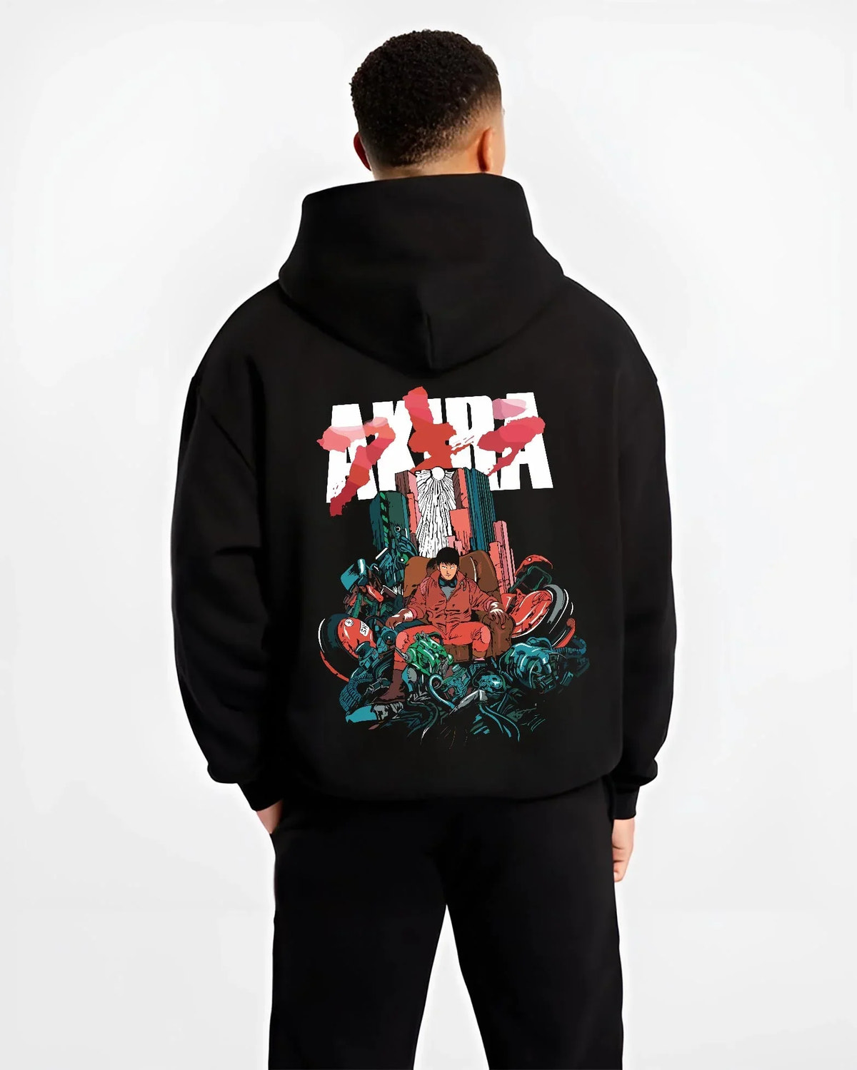 Black hoodie worn by male model, back view with Akira Neo Tokyo Hoodie Capsule Motorcycle Retro Panel graphic premium wear.