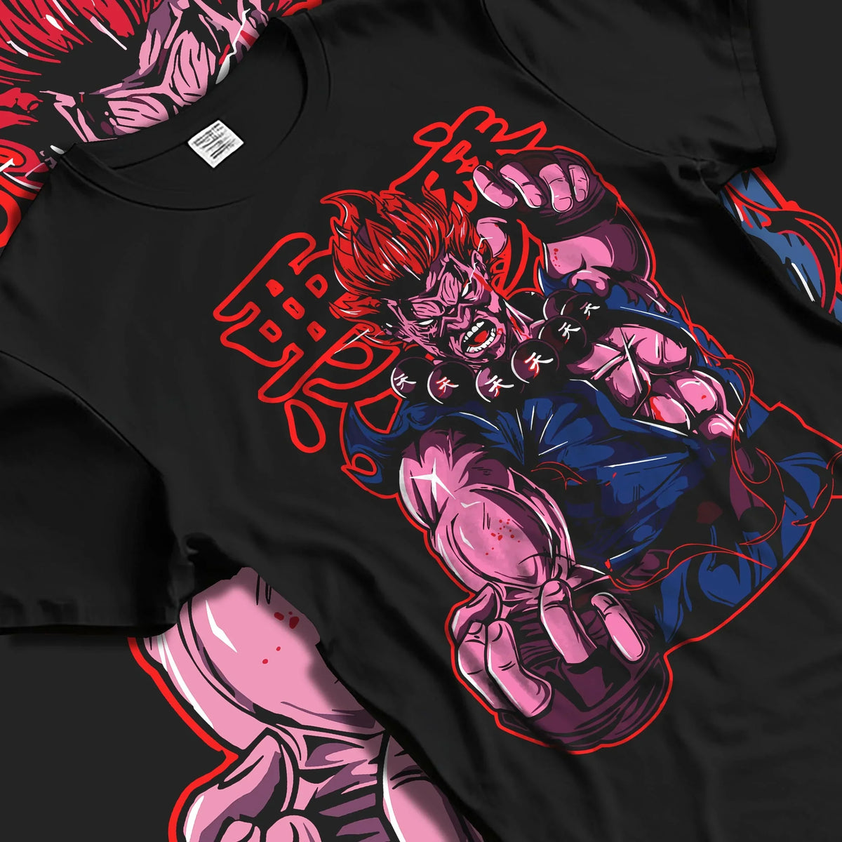 Black T-shirt laid flat with natural folds with Akuma Raging Demon Hoodie Street Fighter Dark Energy graphic bold anime graphic.