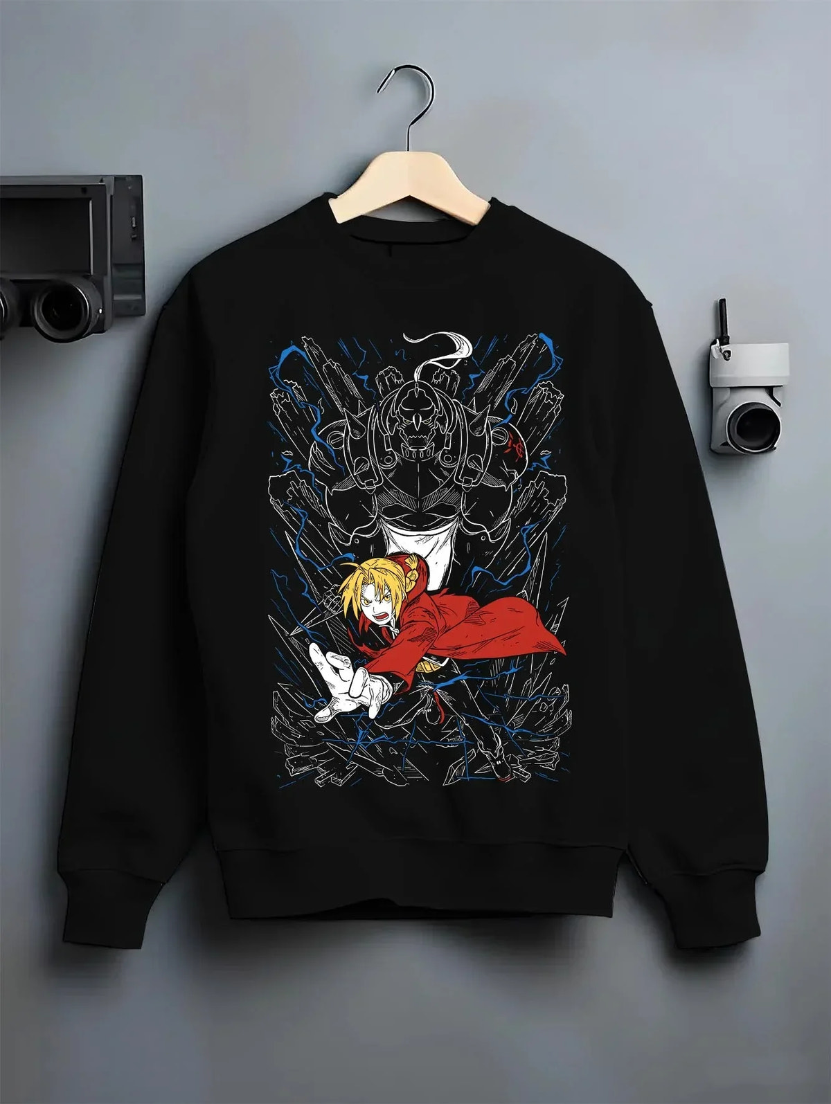 Black crewneck sweatshirt on hanger with Elric Brothers Hoodie Fullmetal Alchemist Battle Bond graphic bold anime graphic.