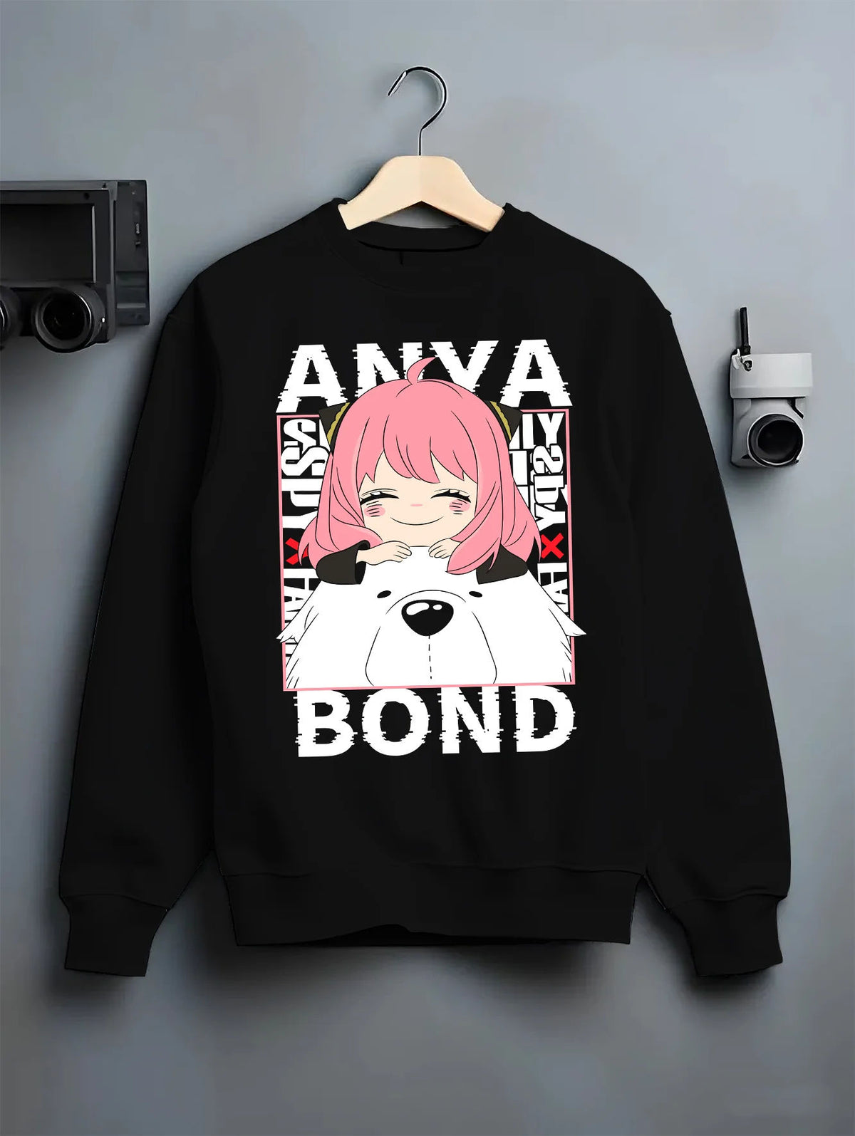 Black crewneck sweatshirt on hanger with Anya Forger and Bond from Spy x Family illustrated back graphic