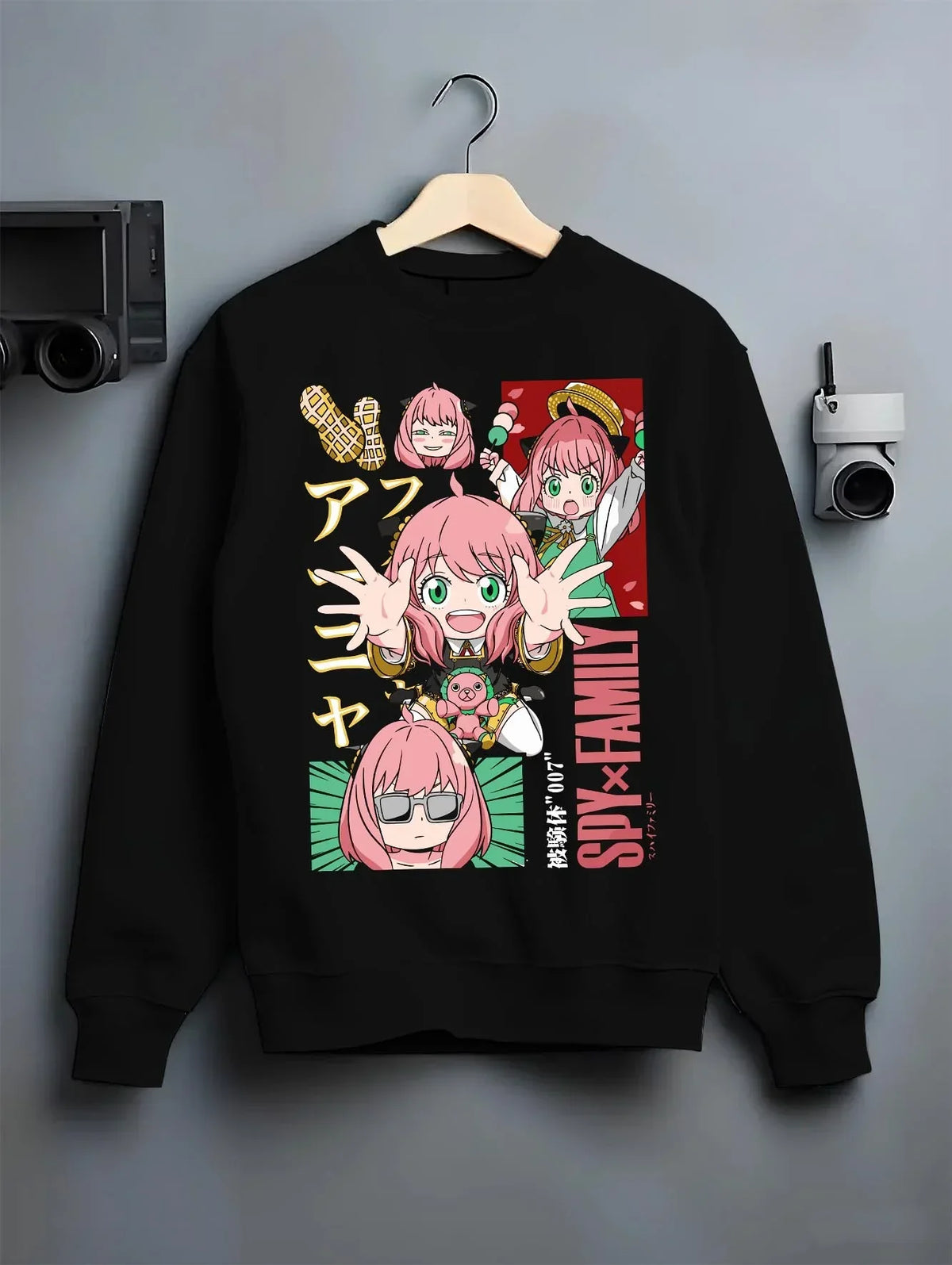 Black crewneck sweatshirt on hanger with Anya Forger Hoodie Spy x Family Cute Panel Collection graphic bold anime graphic.