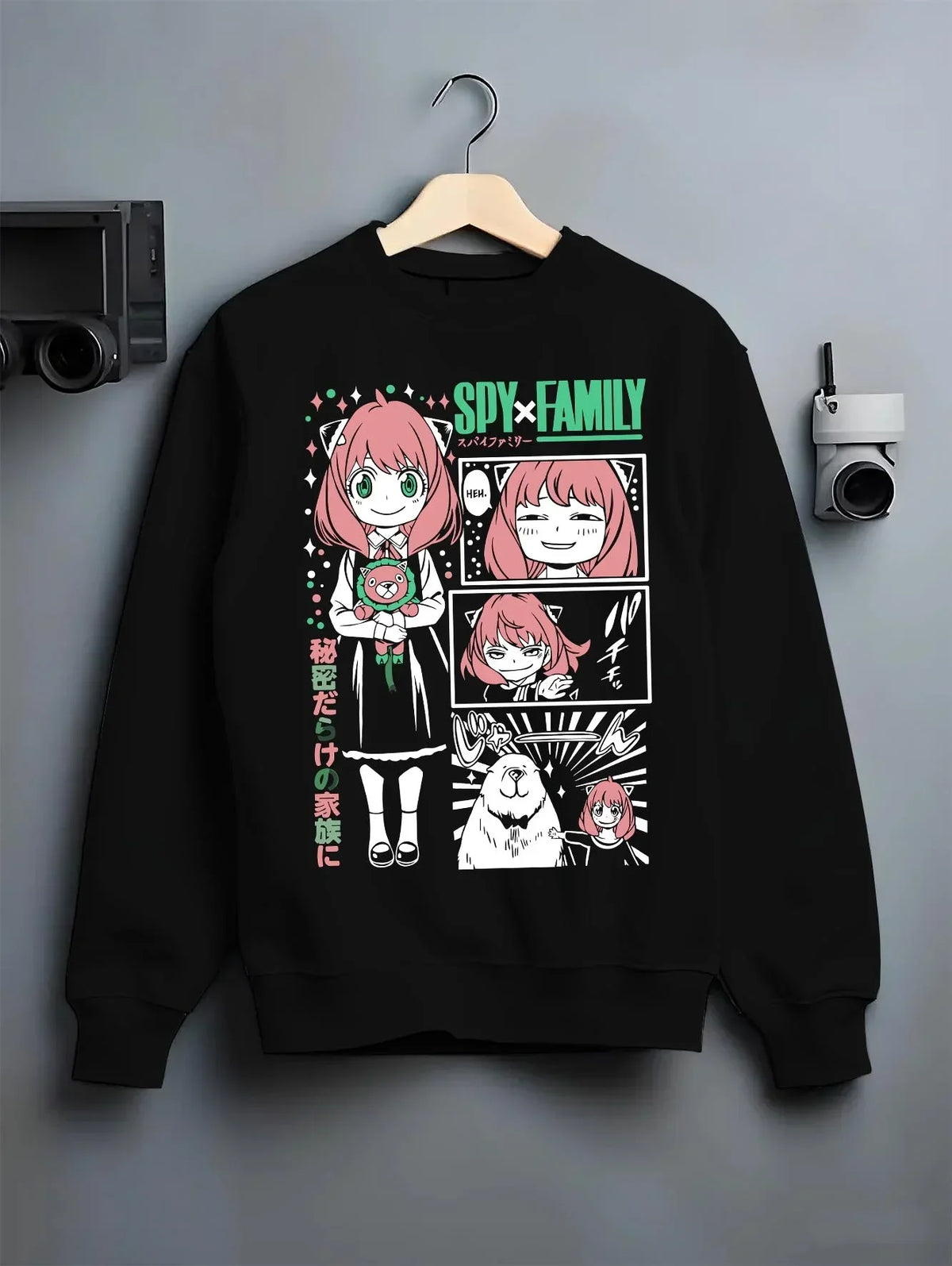 Black crewneck sweatshirt on hanger with Anya Forger Hoodie Spy x Family Manga Comic Collage graphic streetwear graphic.