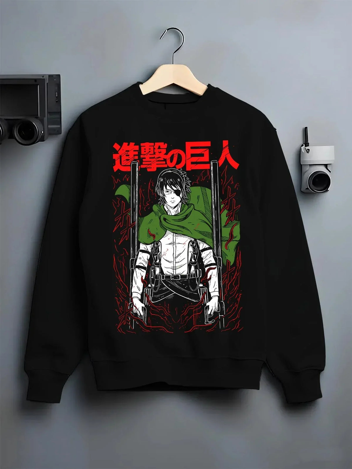 Black crewneck sweatshirt on hanger with Levi Ackerman Hoodie Attack on Titan Captain Blade Pose graphic bold anime graphic.