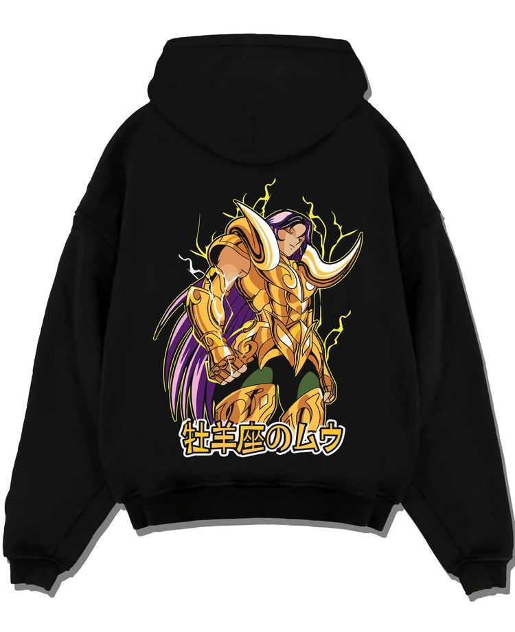 Black pullover hoodie laid flat with Aries Gold Saint Hoodie Saint Seiya Cloth Armour Battle graphic streetwear graphic.
