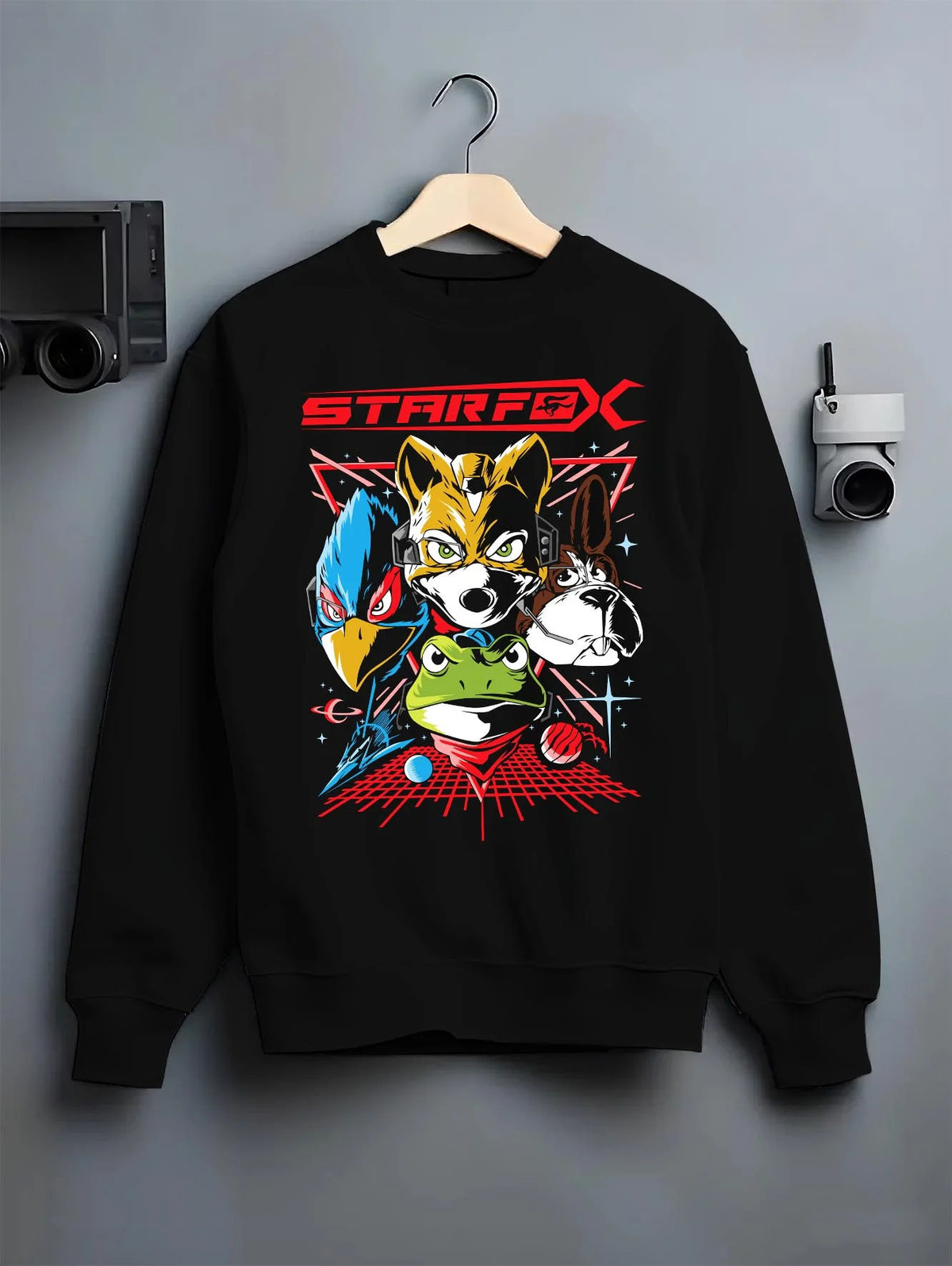 Black crewneck sweatshirt on hanger featuring Fox McCloud Star Fox Arwing pilot artwork.