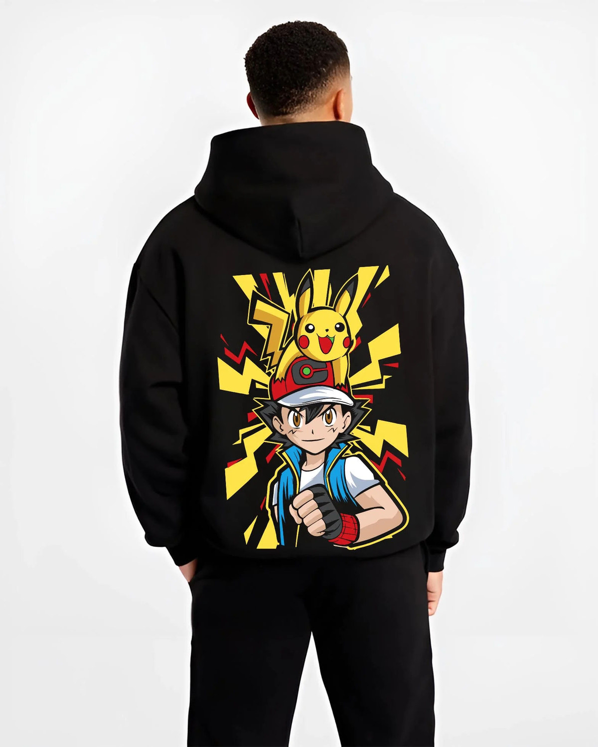Black hoodie worn by male model from the back featuring Ash Ketchum and Pikachu Pokémon journey artwork.
