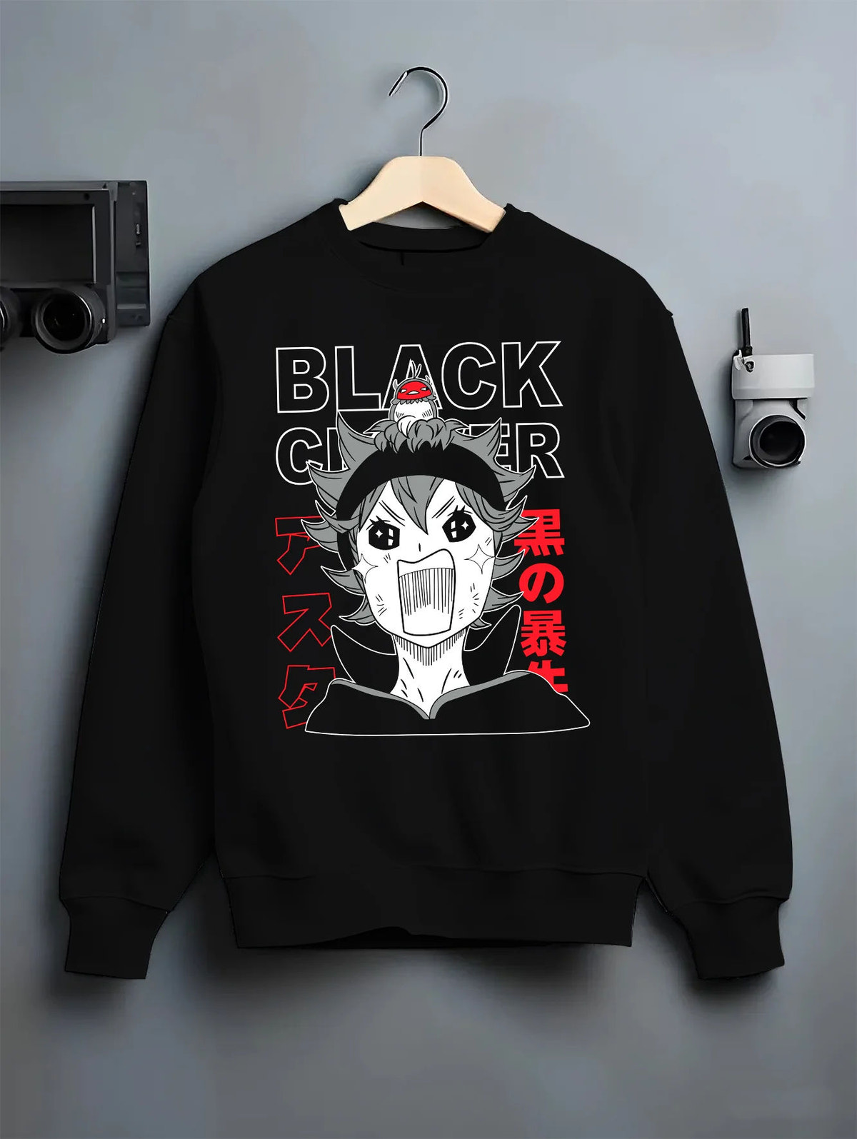 Black crewneck sweatshirt on hanger showing Asta from Black Clover: chibi shouting
