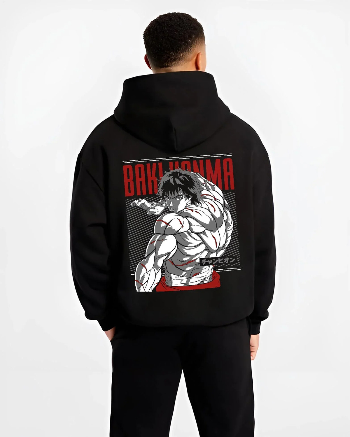 Black hoodie worn by male model, back view with Baki Hanma Hoodie Grappler Baki Martial Arts Fighter graphic streetwear graphic.