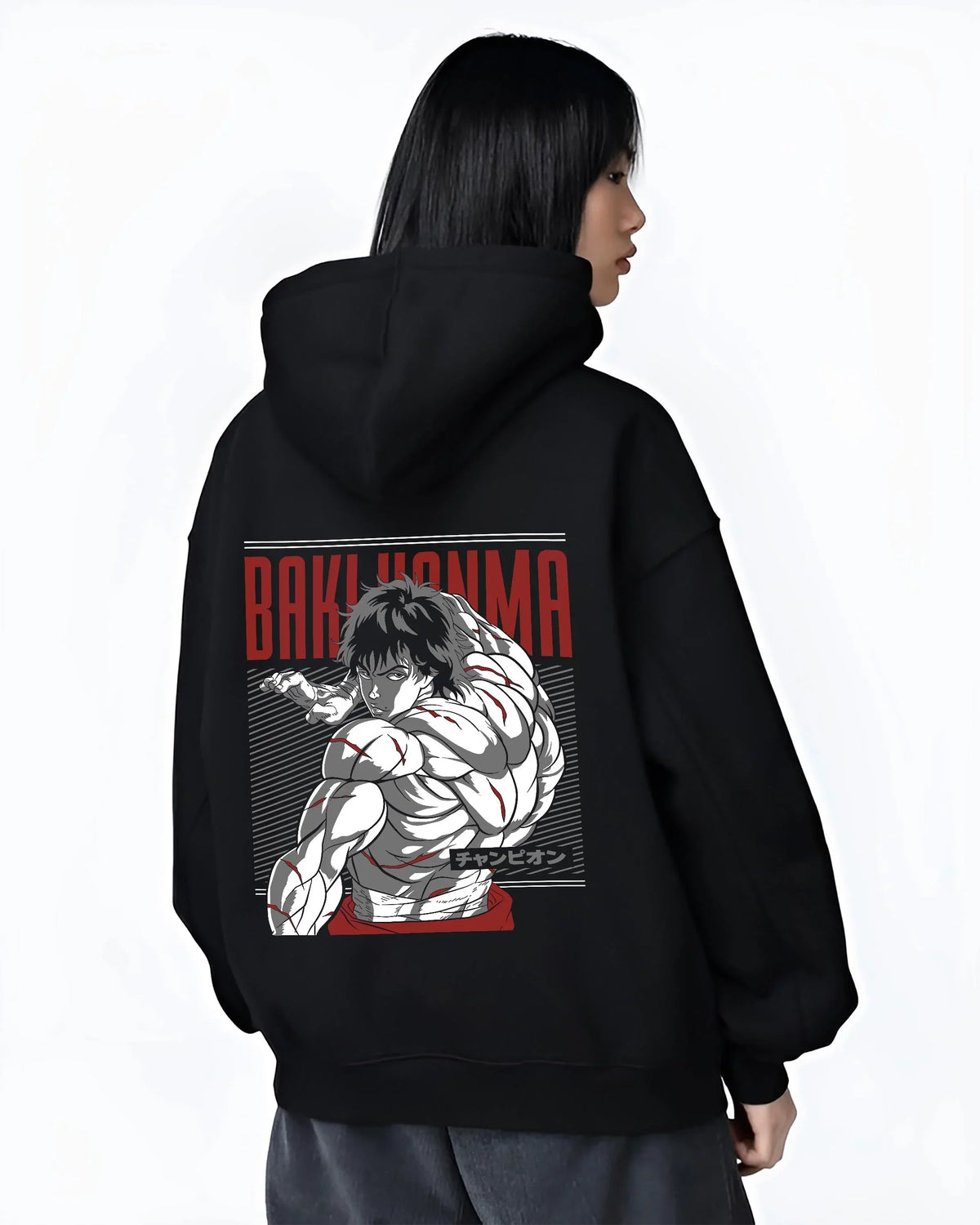 Black hoodie worn by female model, back view with Baki Hanma Hoodie Grappler Baki Martial Arts Fighter graphic bold anime graphic.