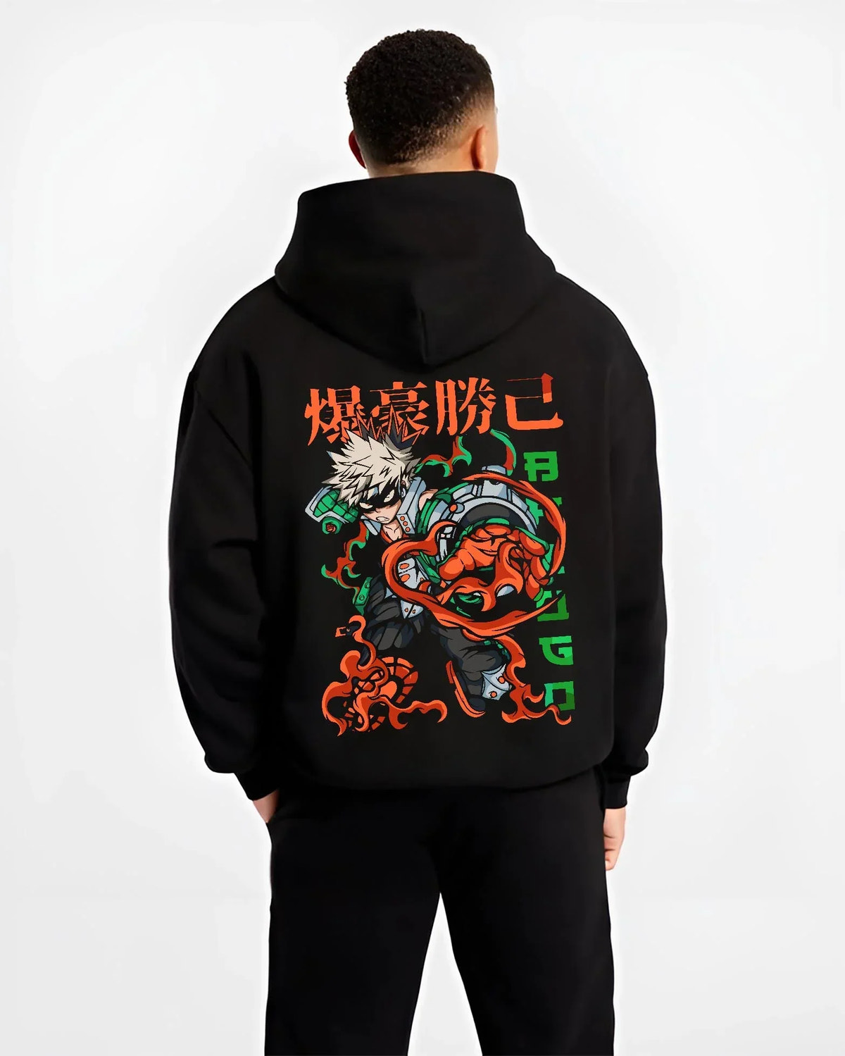Black hoodie worn by male model, back view with Bakugo Power Hoodie My Hero Academia Inferno Battle graphic streetwear graphic.