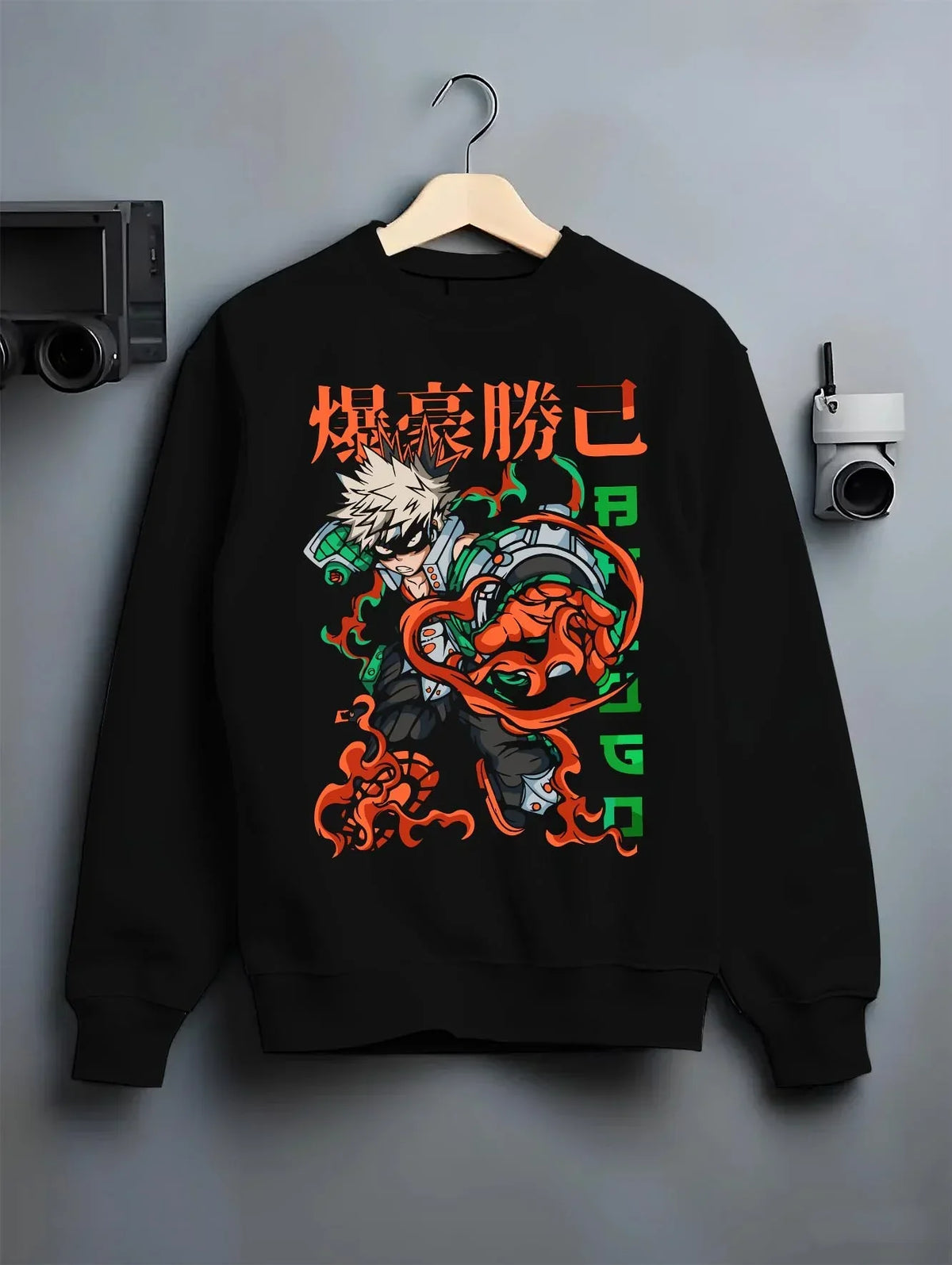 Black crewneck sweatshirt on hanger with Bakugo Power Hoodie My Hero Academia Inferno Battle graphic premium wear.
