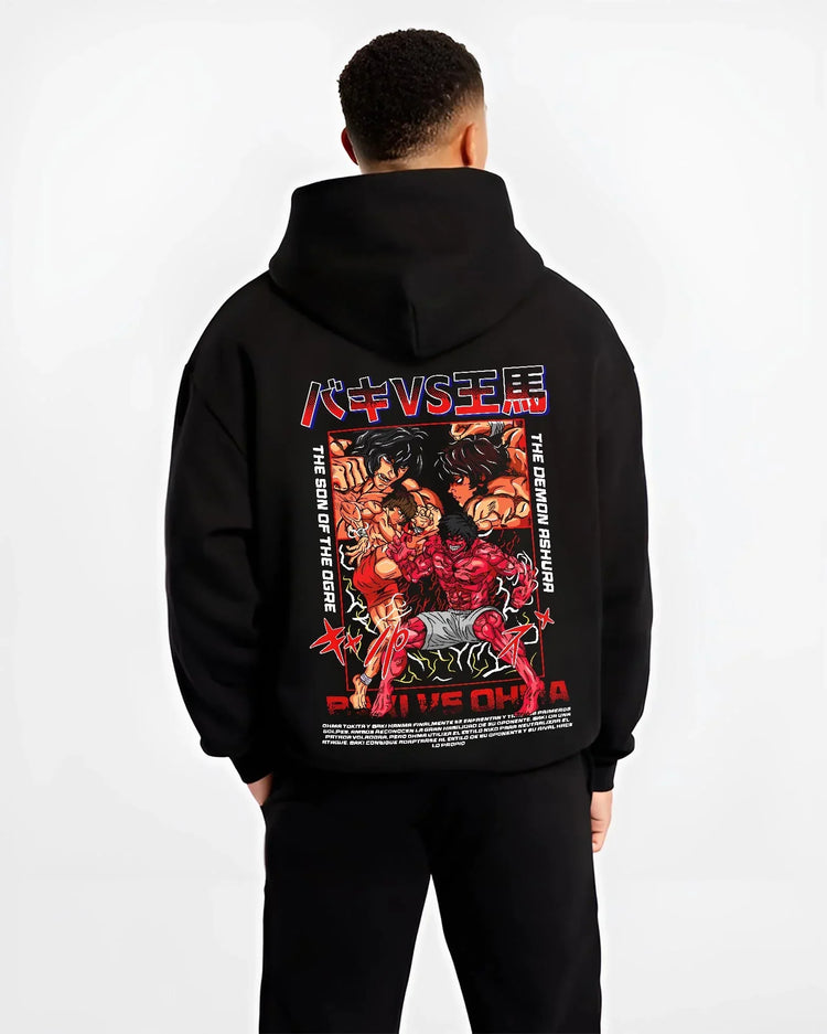 Black hoodie worn by male model, back view with Baki vs Ohma Hoodie Baki Hanma Kengan Ashura Showdown graphic premium wear.