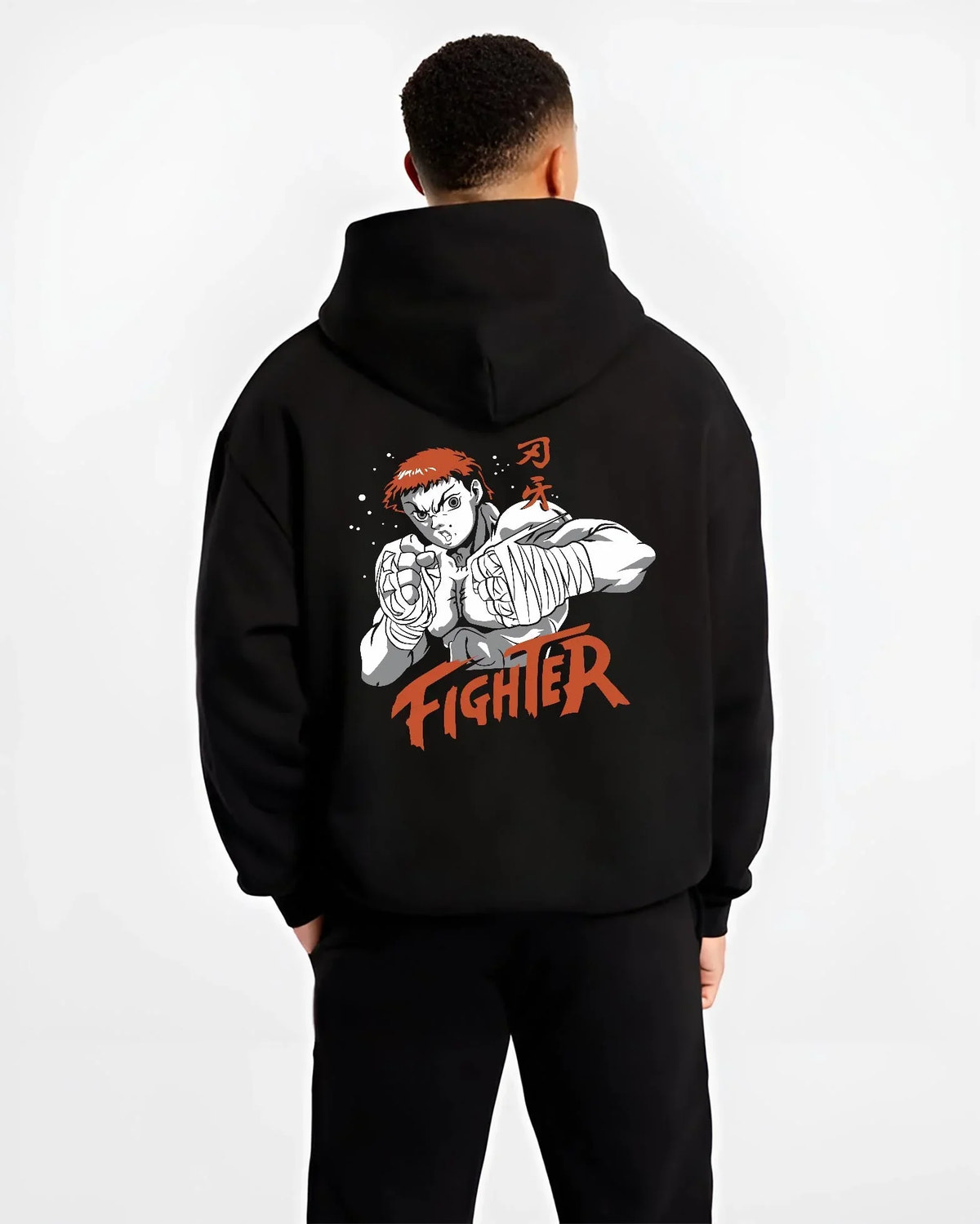 Black hoodie worn by male model, back view with Baki Hanma Hoodie Grappler Baki Fighter Ring Stance graphic streetwear graphic.
