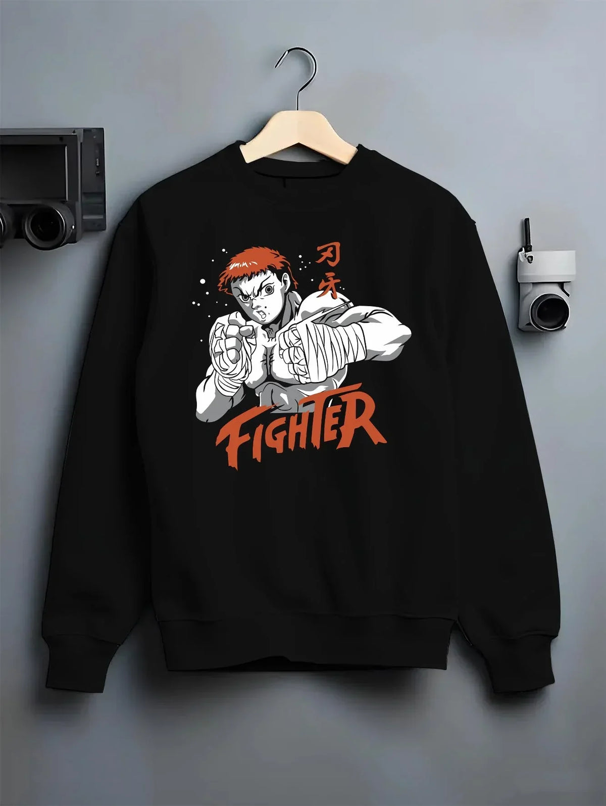 Black crewneck sweatshirt on hanger with Baki Hanma Hoodie Grappler Baki Fighter Ring Stance graphic premium wear.
