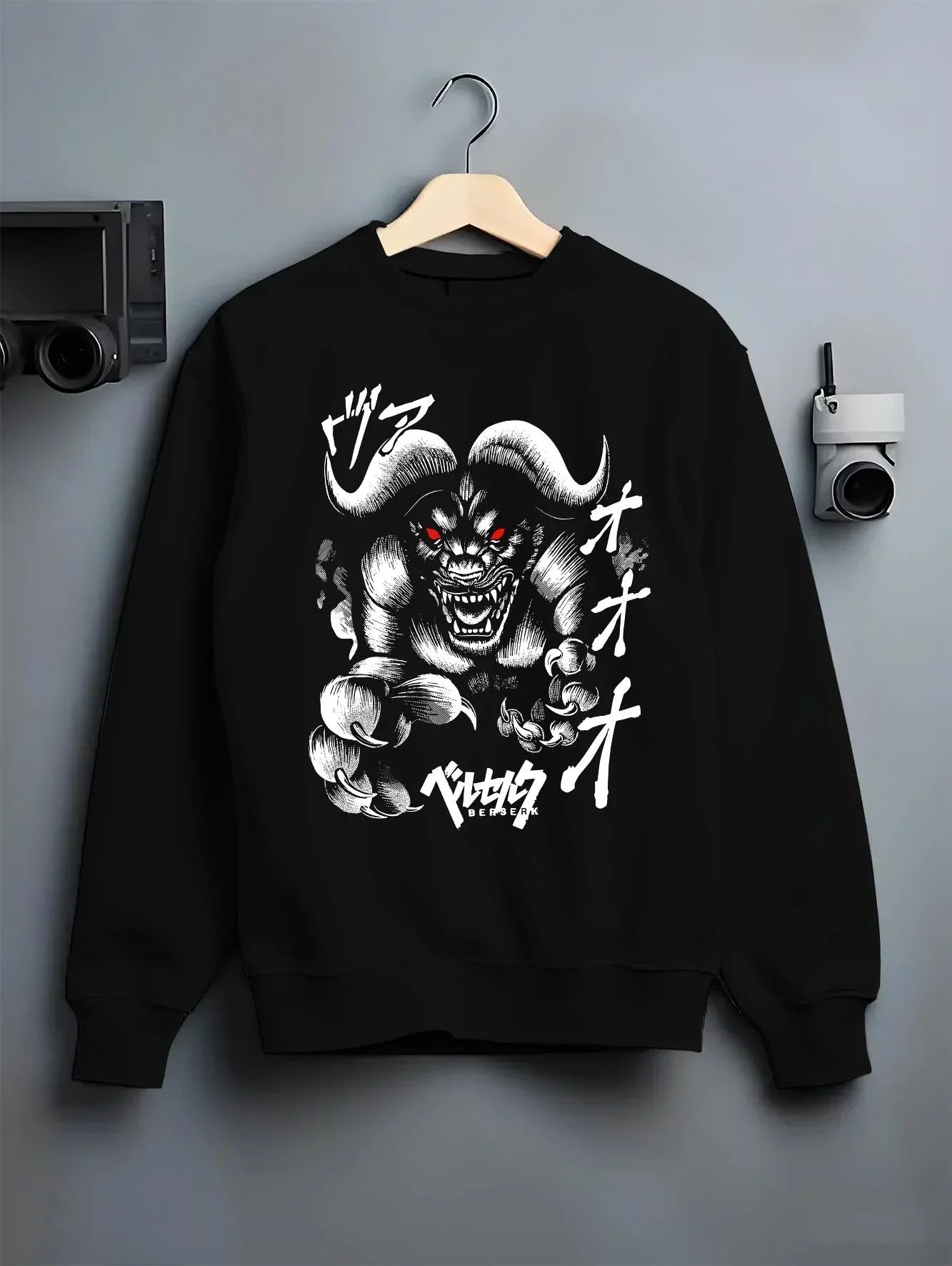 Black crewneck sweatshirt on hanger with Berserk Apostle Hoodie Eclipse Demonic Beast Form graphic bold anime graphic.