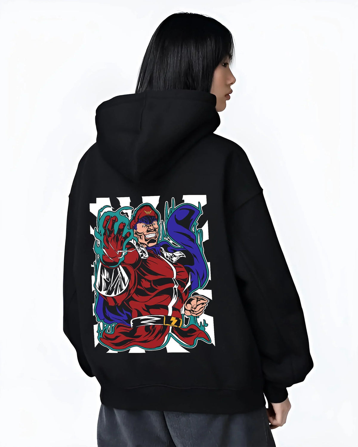 Black hoodie worn by female model, back view with M. Bison Hoodie Street Fighter Psycho Power Pose graphic premium wear.