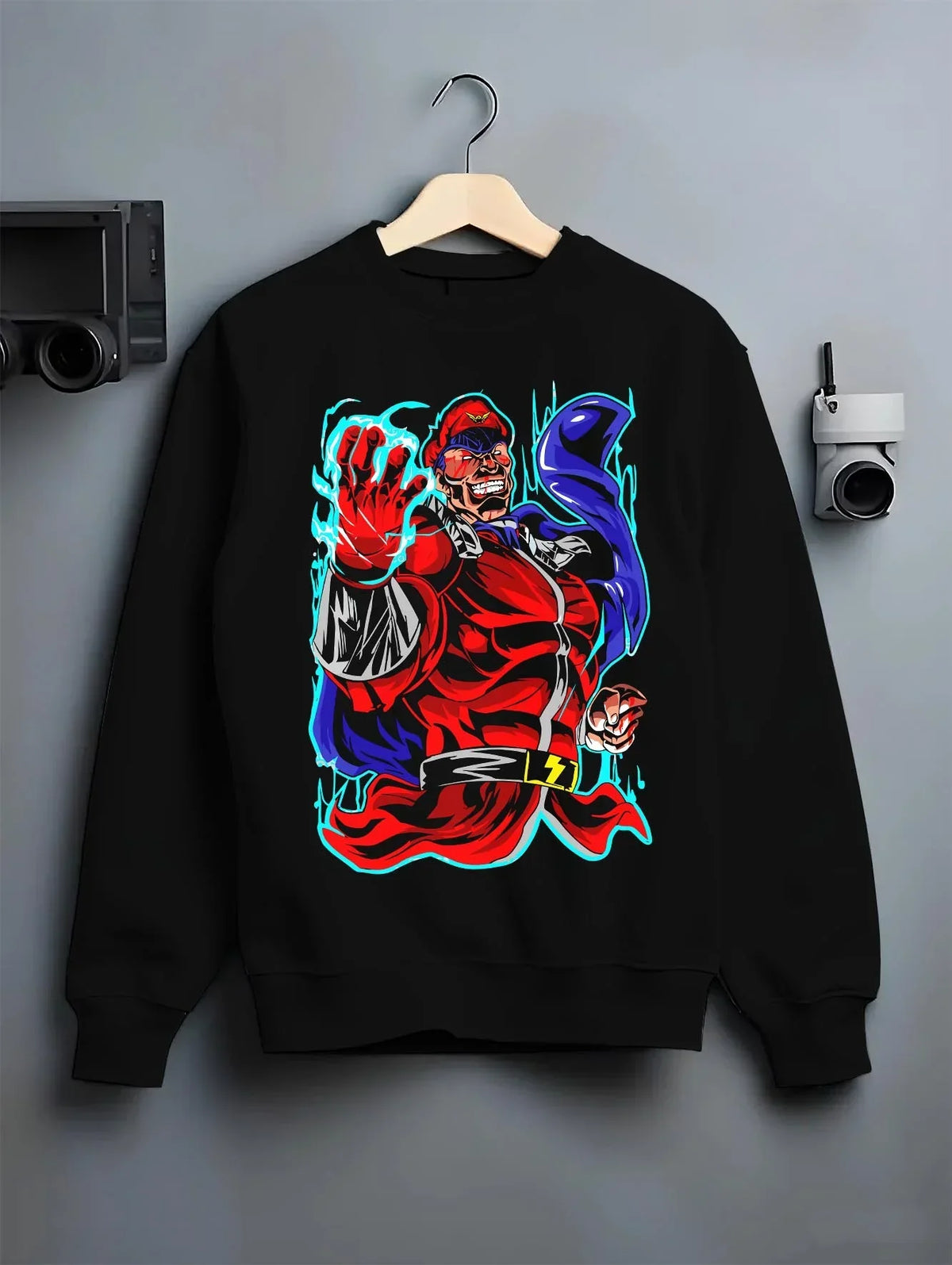 Black crewneck sweatshirt on hanger with M. Bison Hoodie Street Fighter Red Aura Flame Power graphic streetwear graphic.