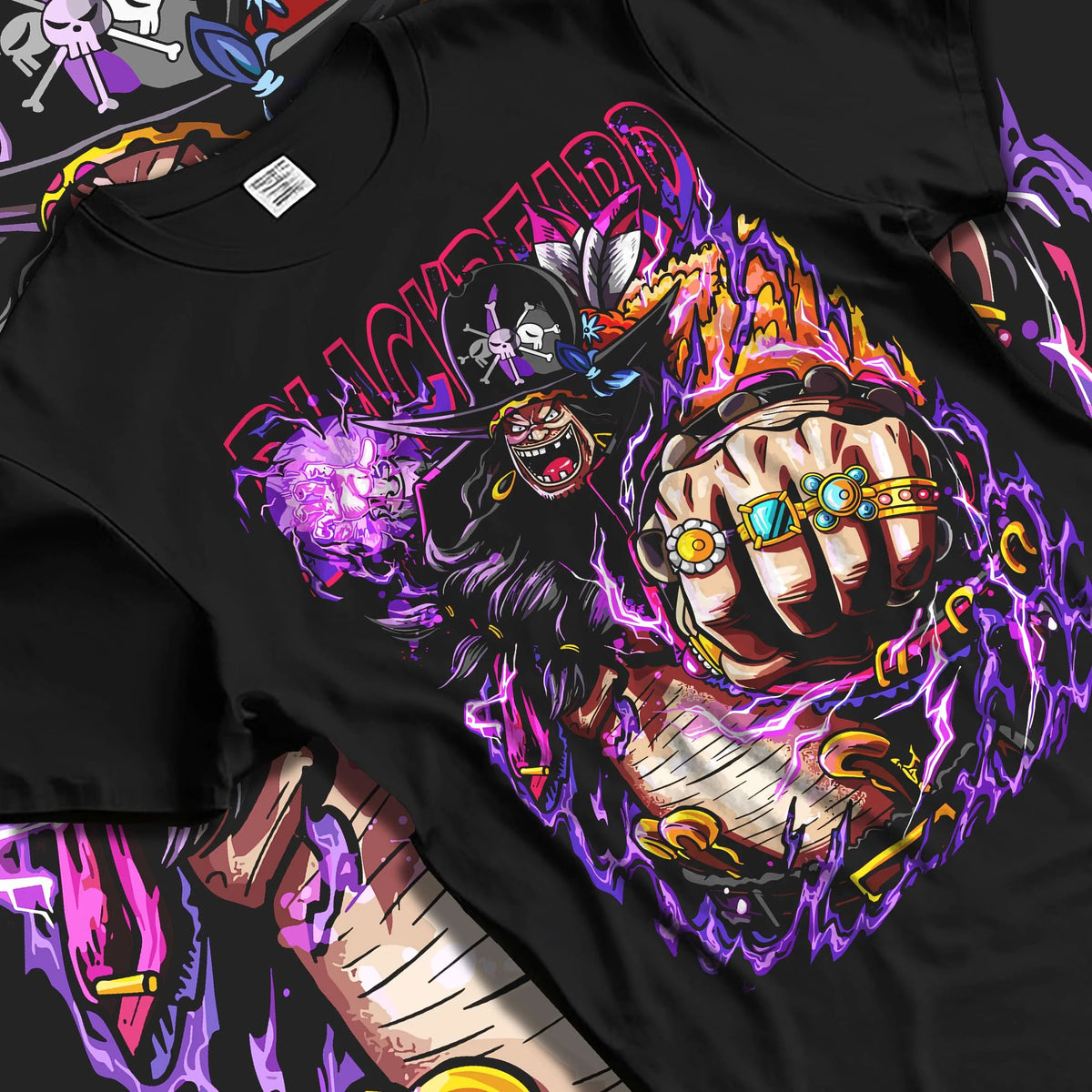 Black T-shirt laid flat with natural folds featuring Blackbeard One Piece dark power artwork.