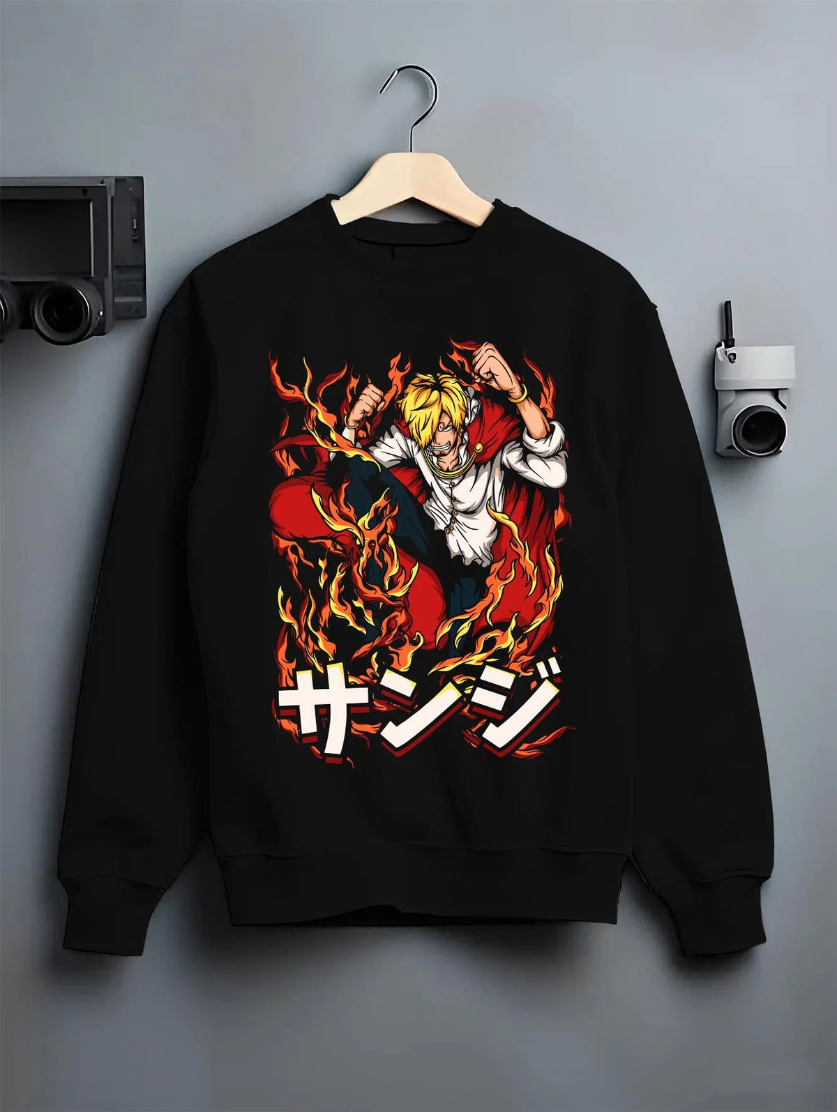 Black crewneck sweatshirt on hanger featuring Sanji Black Leg One Piece fiery kick artwork.