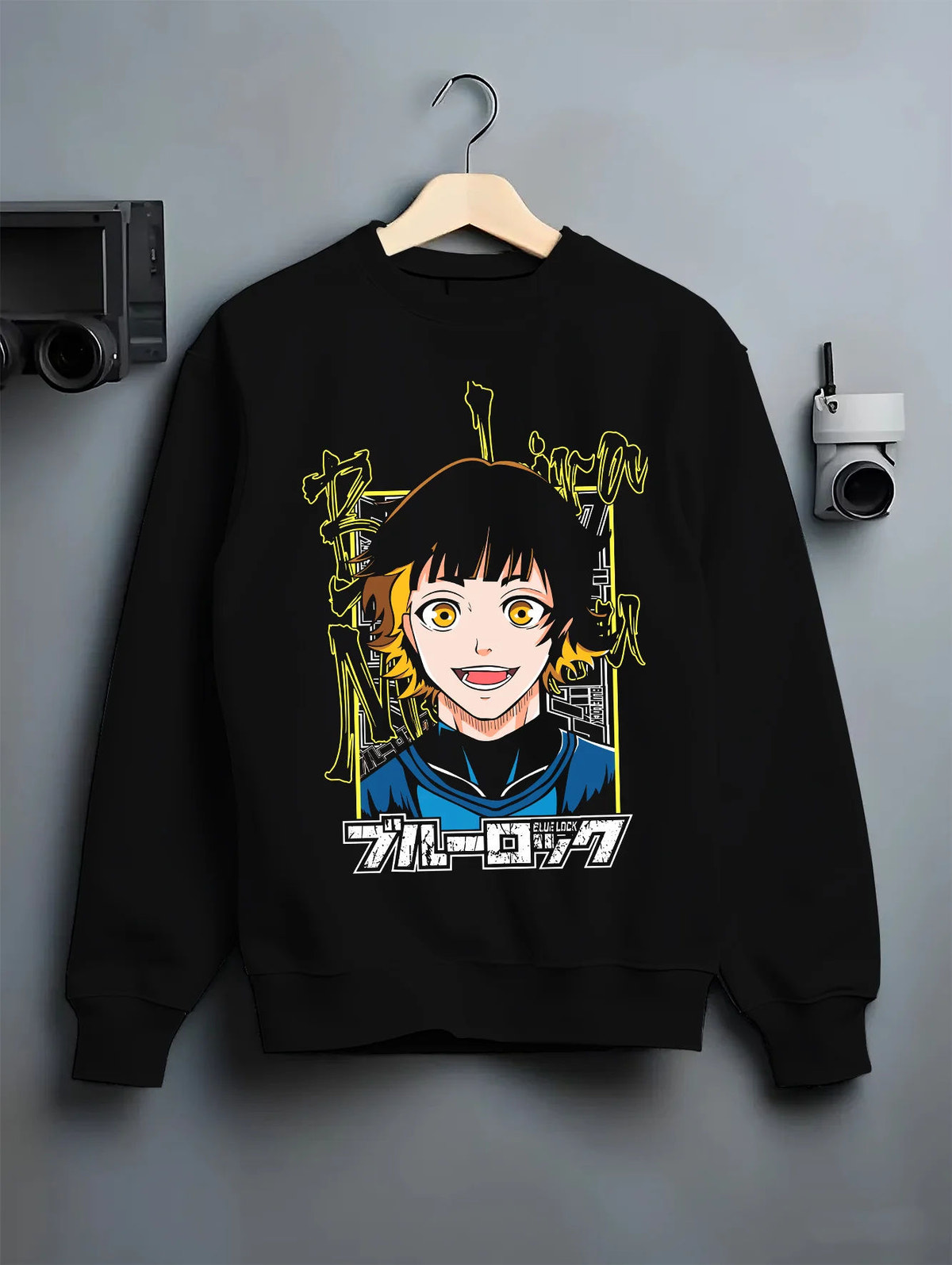 Black crewneck sweatshirt on hanger showing Blue Lock: player with yellow eyes