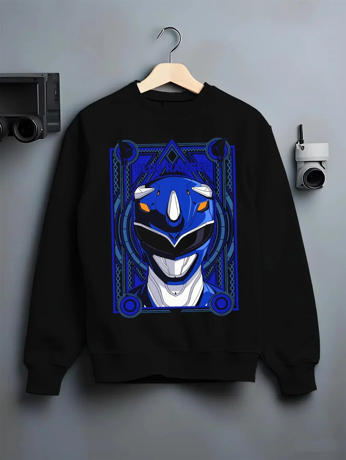 Black crewneck sweatshirt on hanger with Blue Ranger Hoodie Power Rangers Classic Retro Pose graphic streetwear graphic.