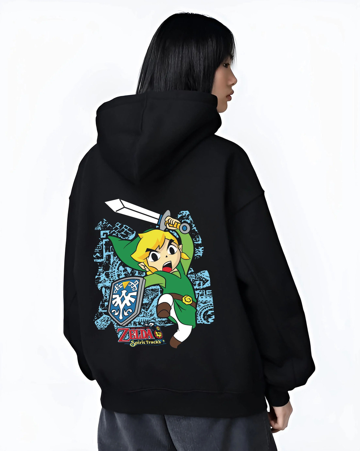 Black hoodie worn by female model from the back featuring Link Breath of the Wild blue tunic artwork.