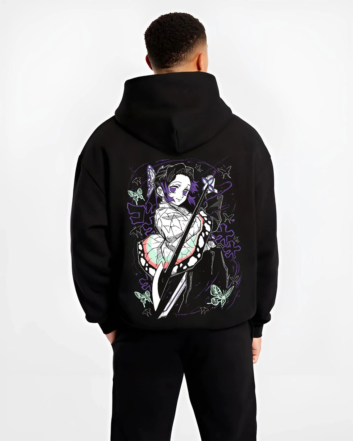 Black hoodie worn by male model from the back featuring Shinobu Kocho Butterfly Dance Demon Slayer artwork.
