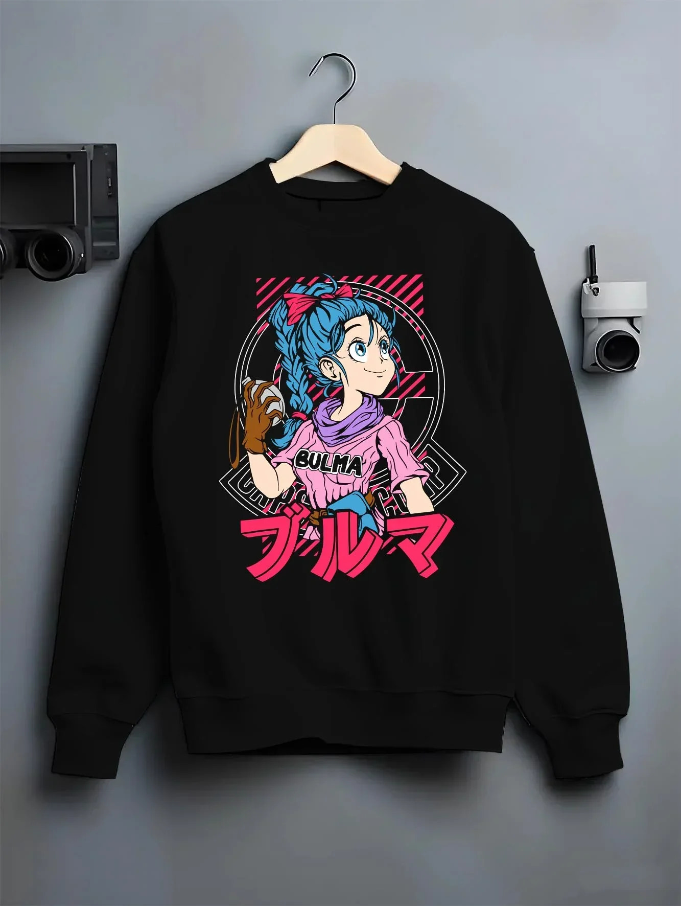 Black crewneck sweatshirt on hanger with Bulma Hoodie Dragon Ball Z Pink Outfit Capsule Corp graphic streetwear graphic.