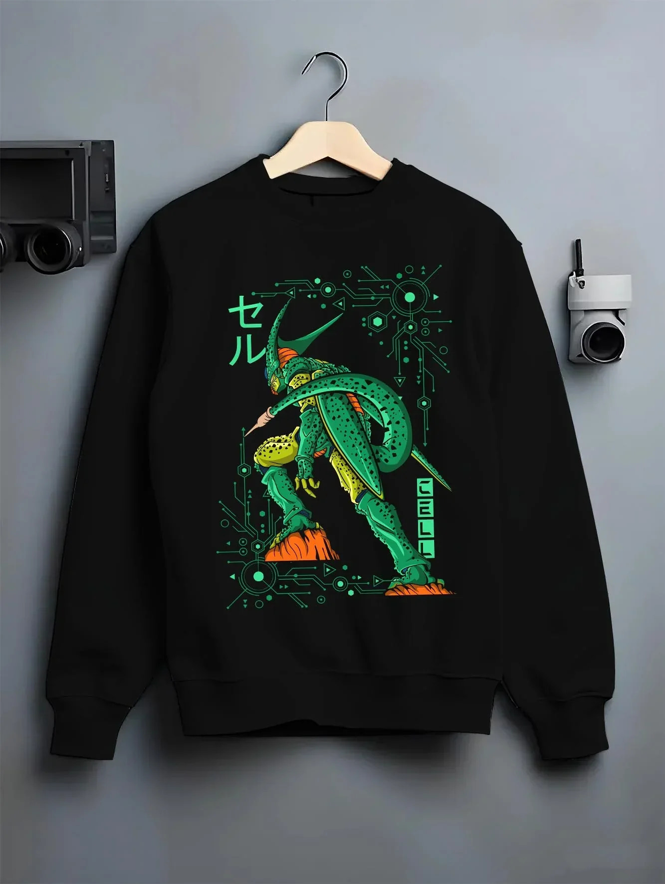 Black crewneck sweatshirt on hanger with Cell Hoodie Dragon Ball Z Perfect Villain Evolution graphic premium wear.