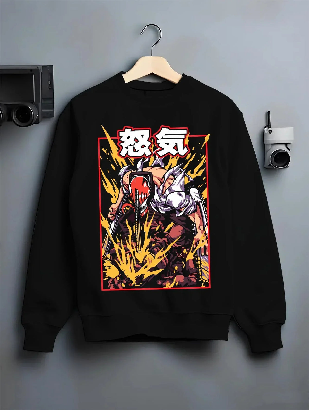Black crewneck sweatshirt on hanger with Chainsaw Man Hoodie Denji Devil Hunter Rage Flames graphic streetwear graphic.