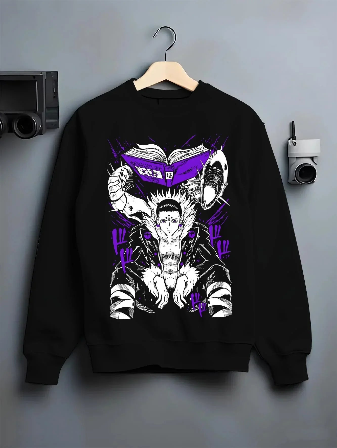 Black crewneck sweatshirt on hanger with Chrollo Hoodie Hunter x Hunter Phantom Troupe Leader graphic bold anime graphic.
